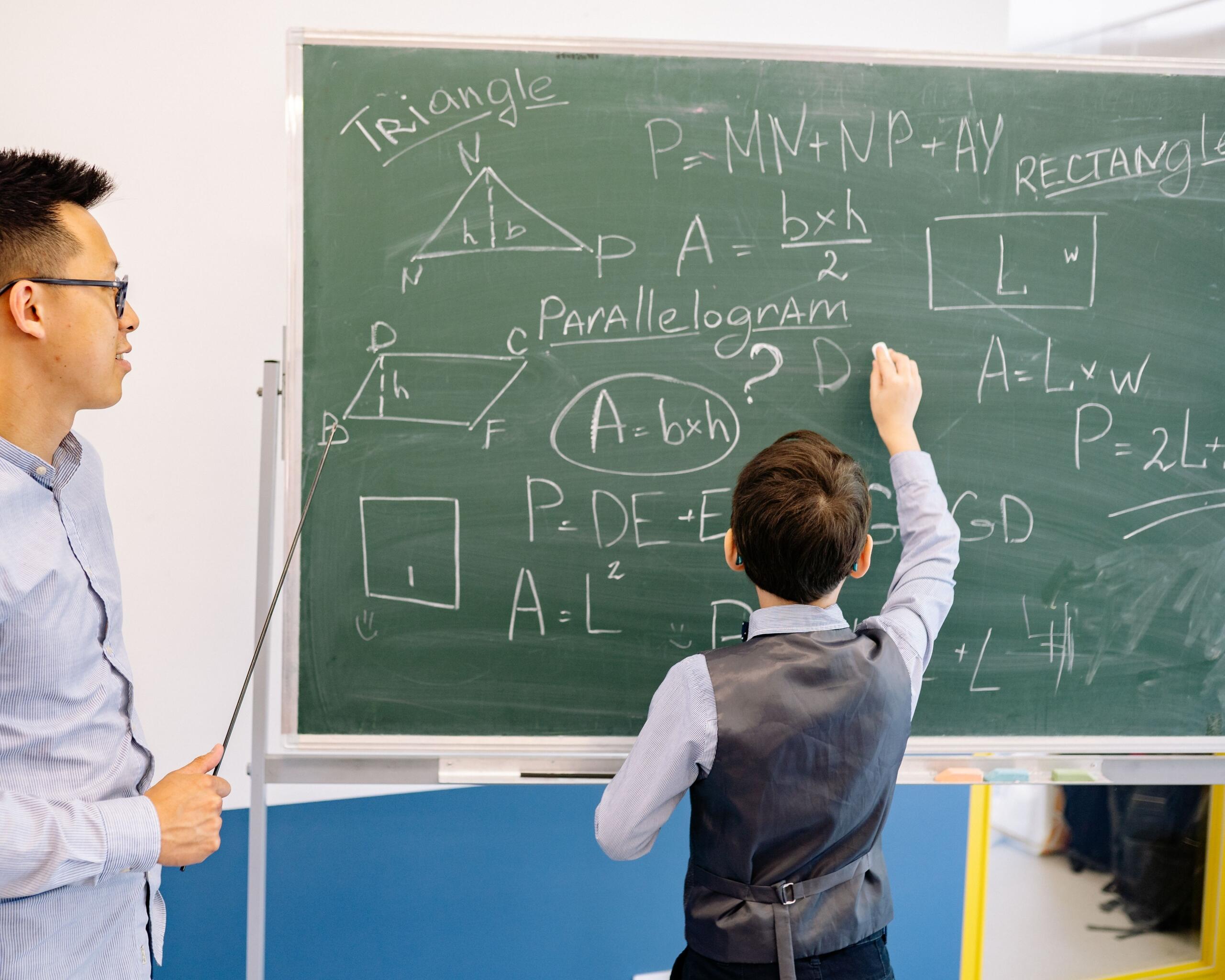 Math student writing on the board