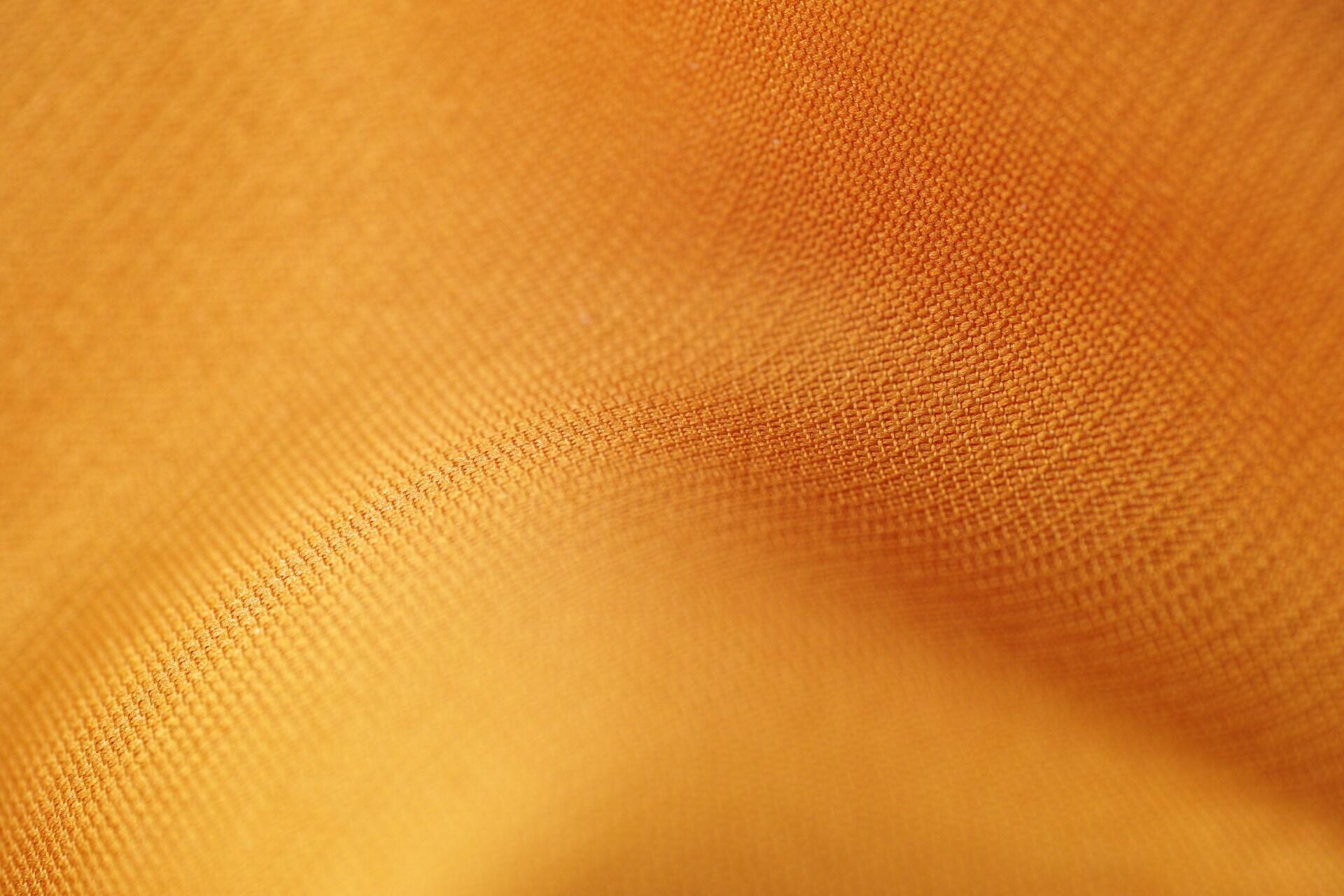 close-up shot of knit yellow fabric with texture showing