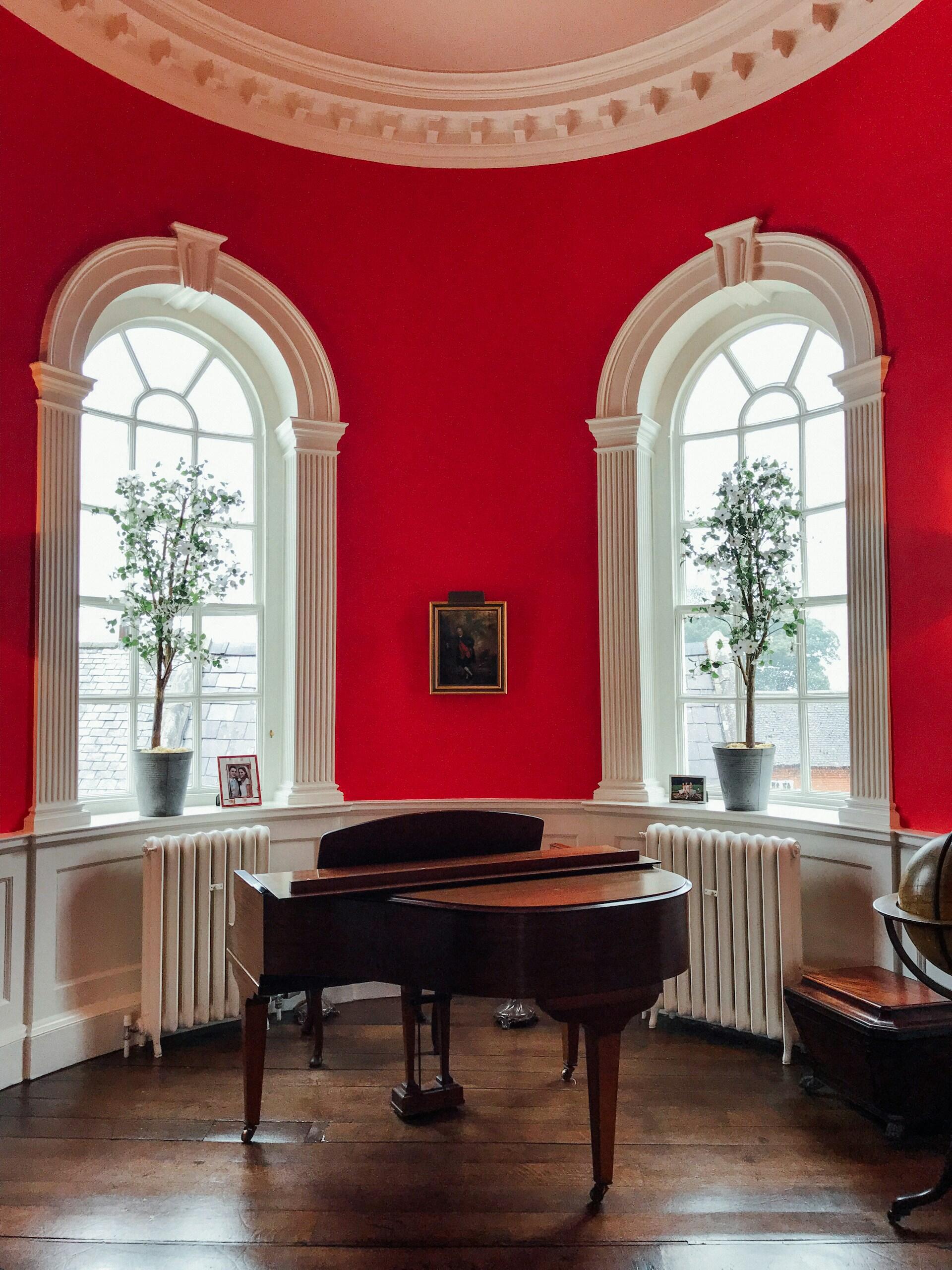A grand piano in a living room.