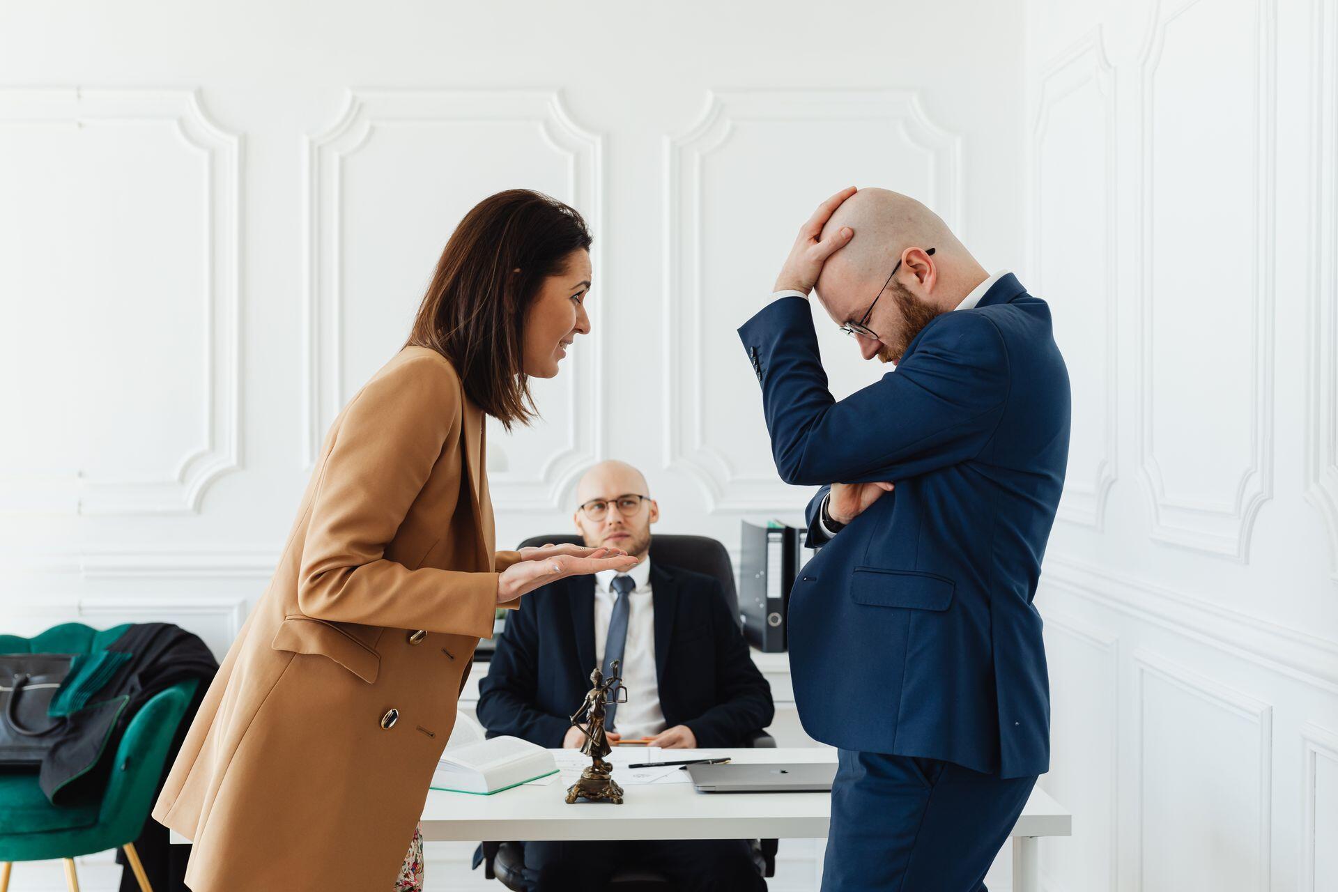 two people arguing in a lawyer's office