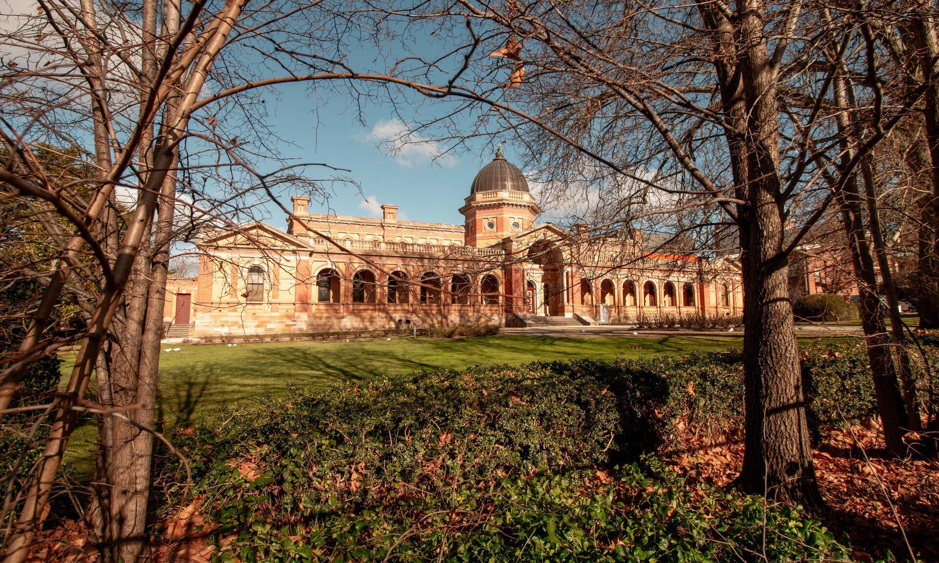 a large, ornate courthouse made of brick with many columns