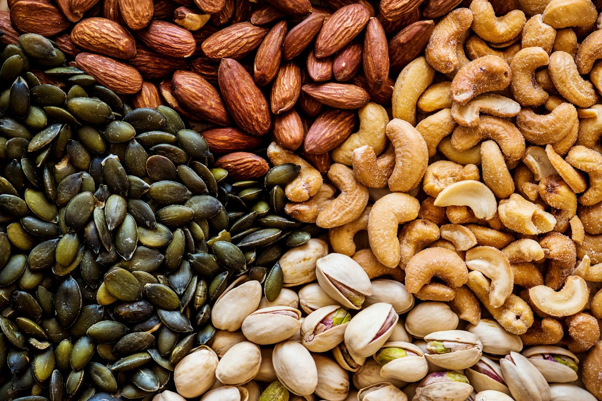almonds, cashews, pistachios, and pumpkin seeds arranged in neat triangles