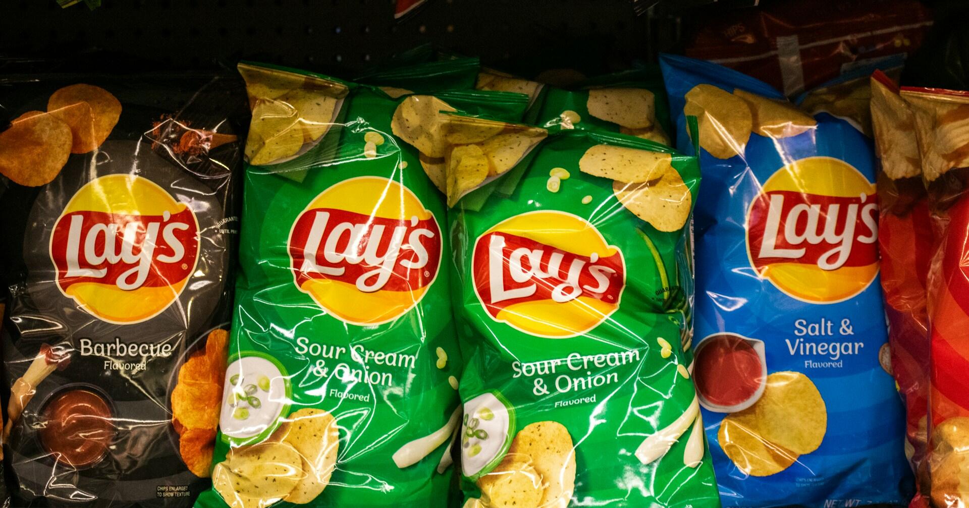 varieties of crisps with different flavours, some of which have milk (dairy) in them