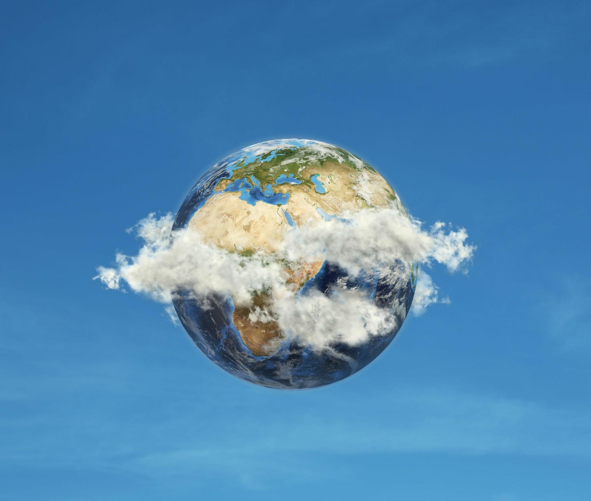 An image of Earth enveloped in soft clouds.