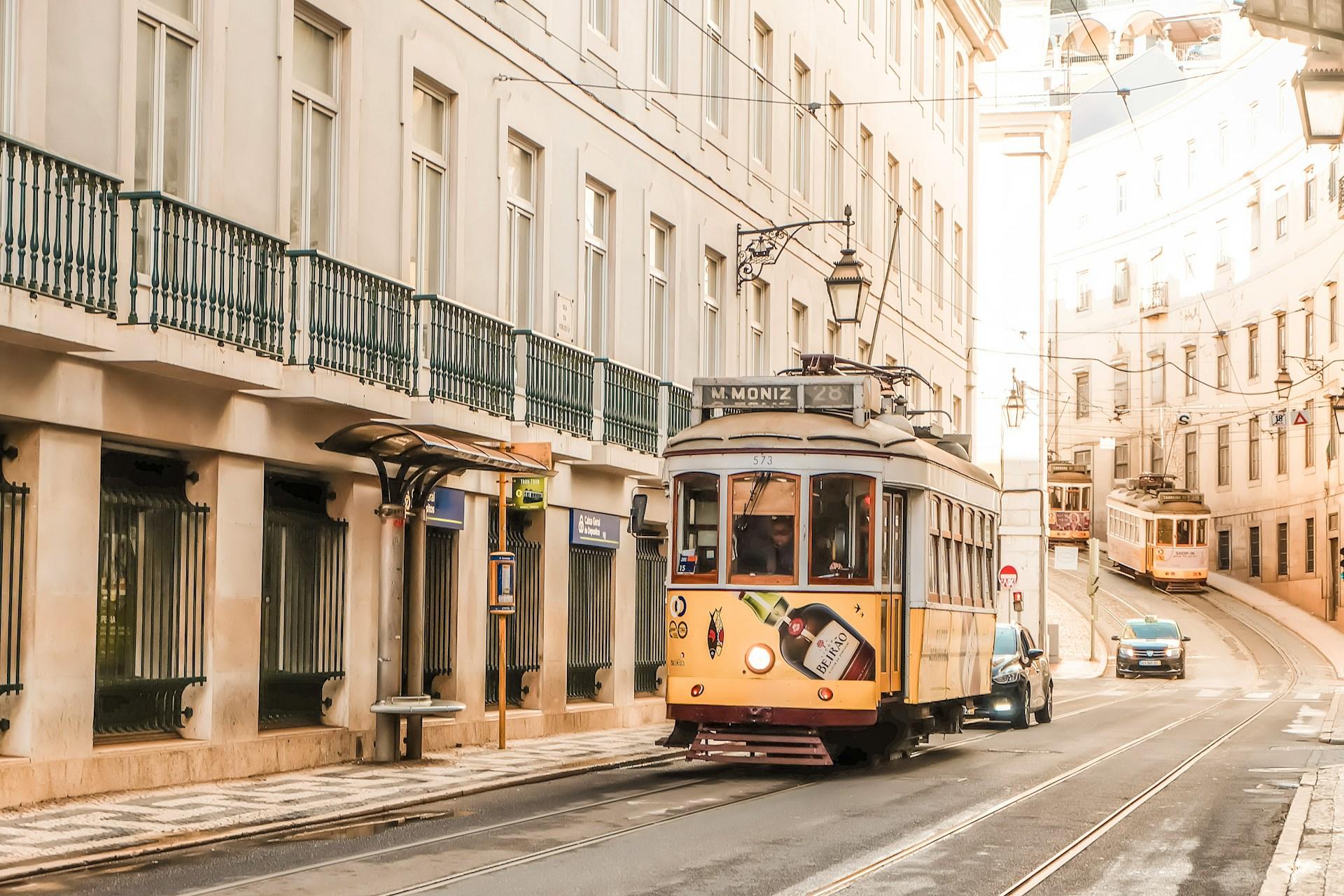 a yellow tram on the street