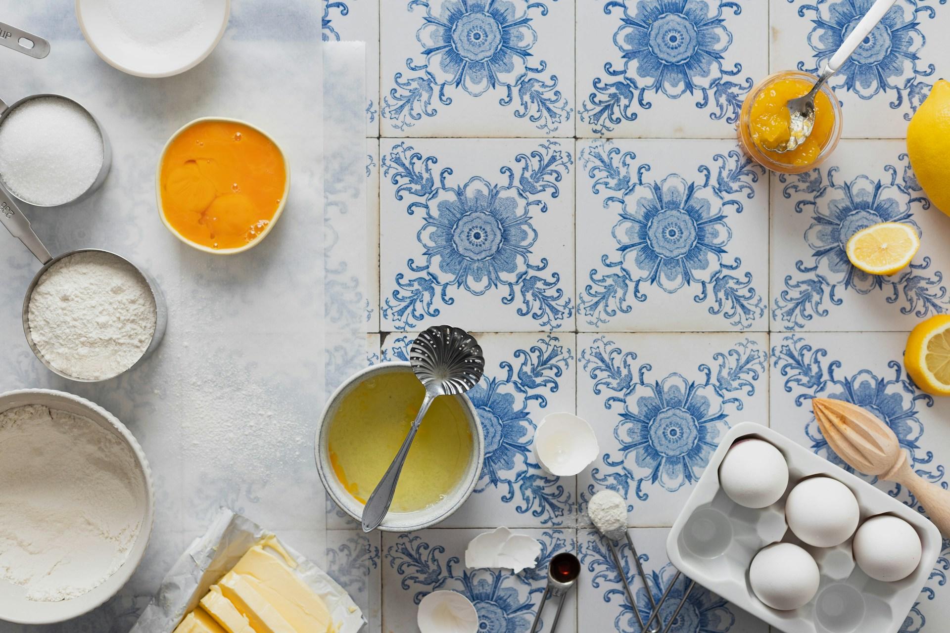 a table with blue and white patterned tiles