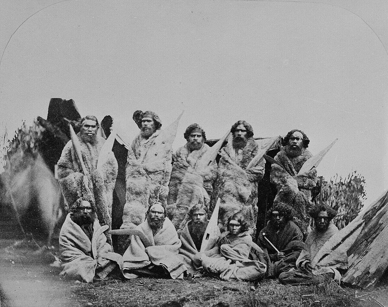1858 black and white photo Group of Aboriginal men in possum skin cloaks and blankets