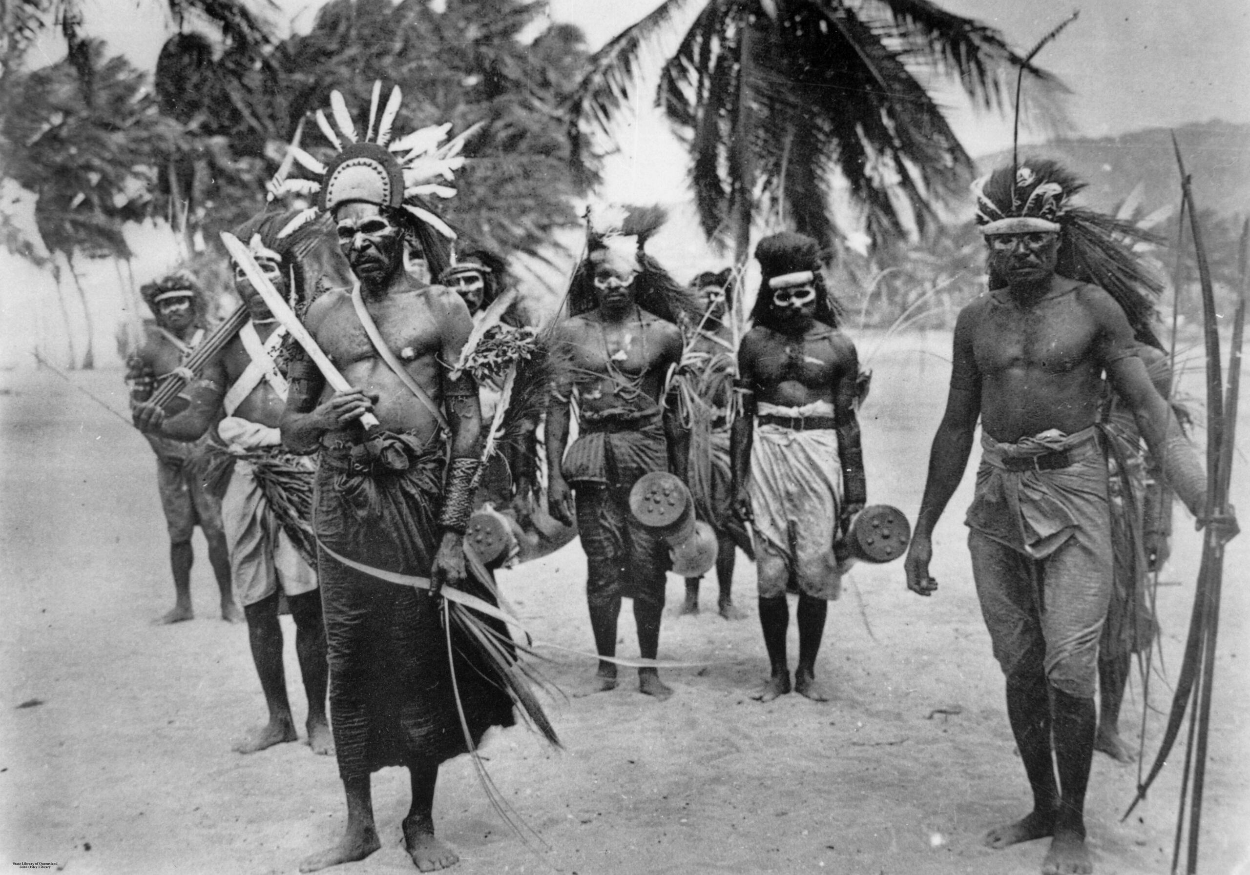 black and white photo of Boigu Island Warriors with brown and arrows.