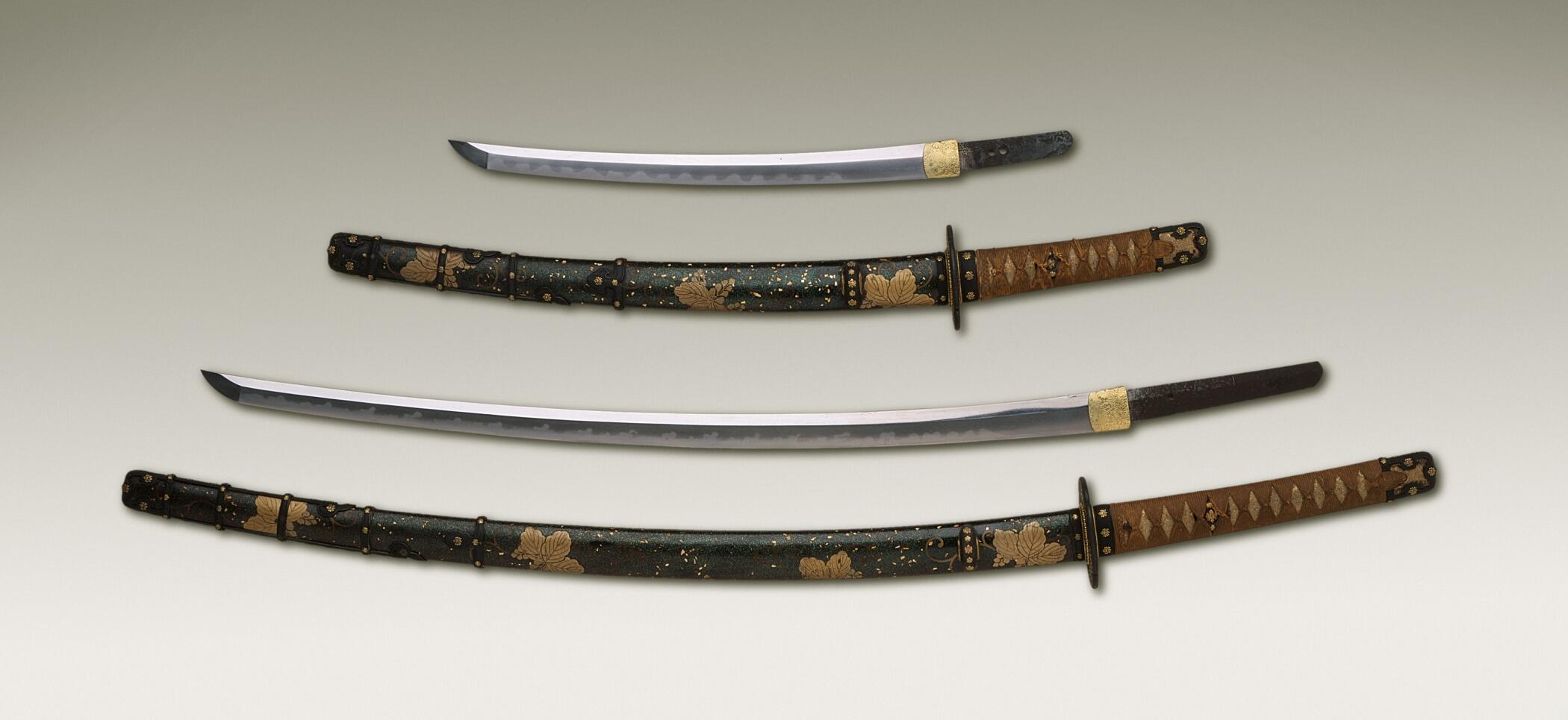 Two curved-blade swords and their sheaths. 