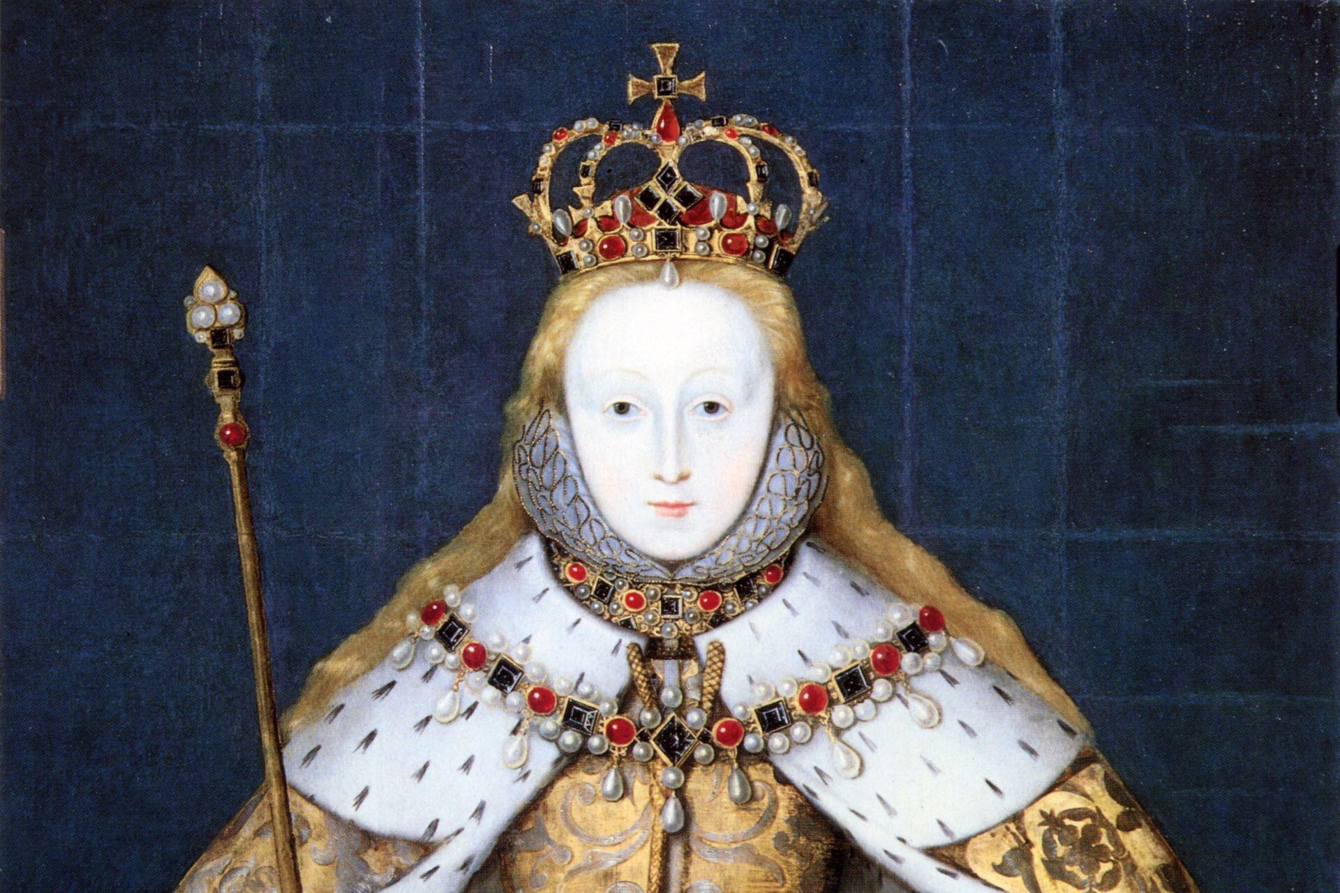Portrait of a crowned queen wearing a white ceremonial gown, jewelled collar, ermine-trimmed robe, and holding a royal sceptre against a dark blue background.