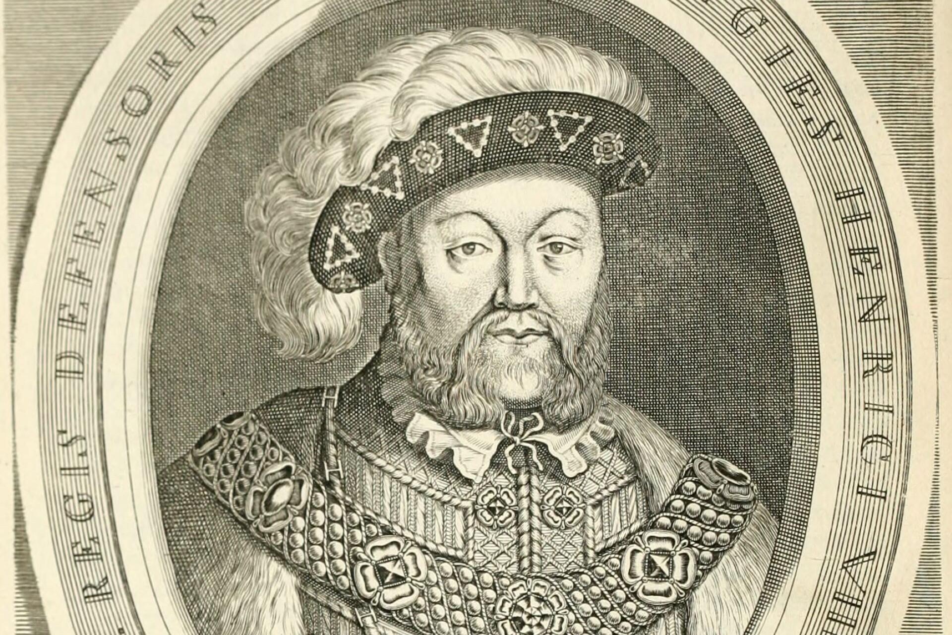 Engraved black and white portrait of a bearded Tudor king wearing ornate clothing, a decorated hat, and a chain of royal insignia.
