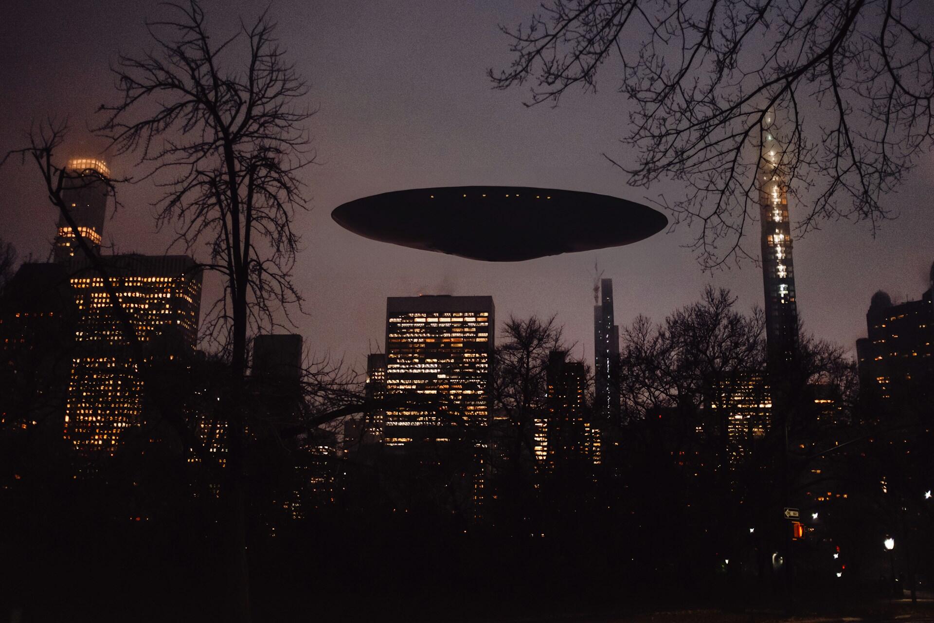 picture of a UFO / UAP above a city at night