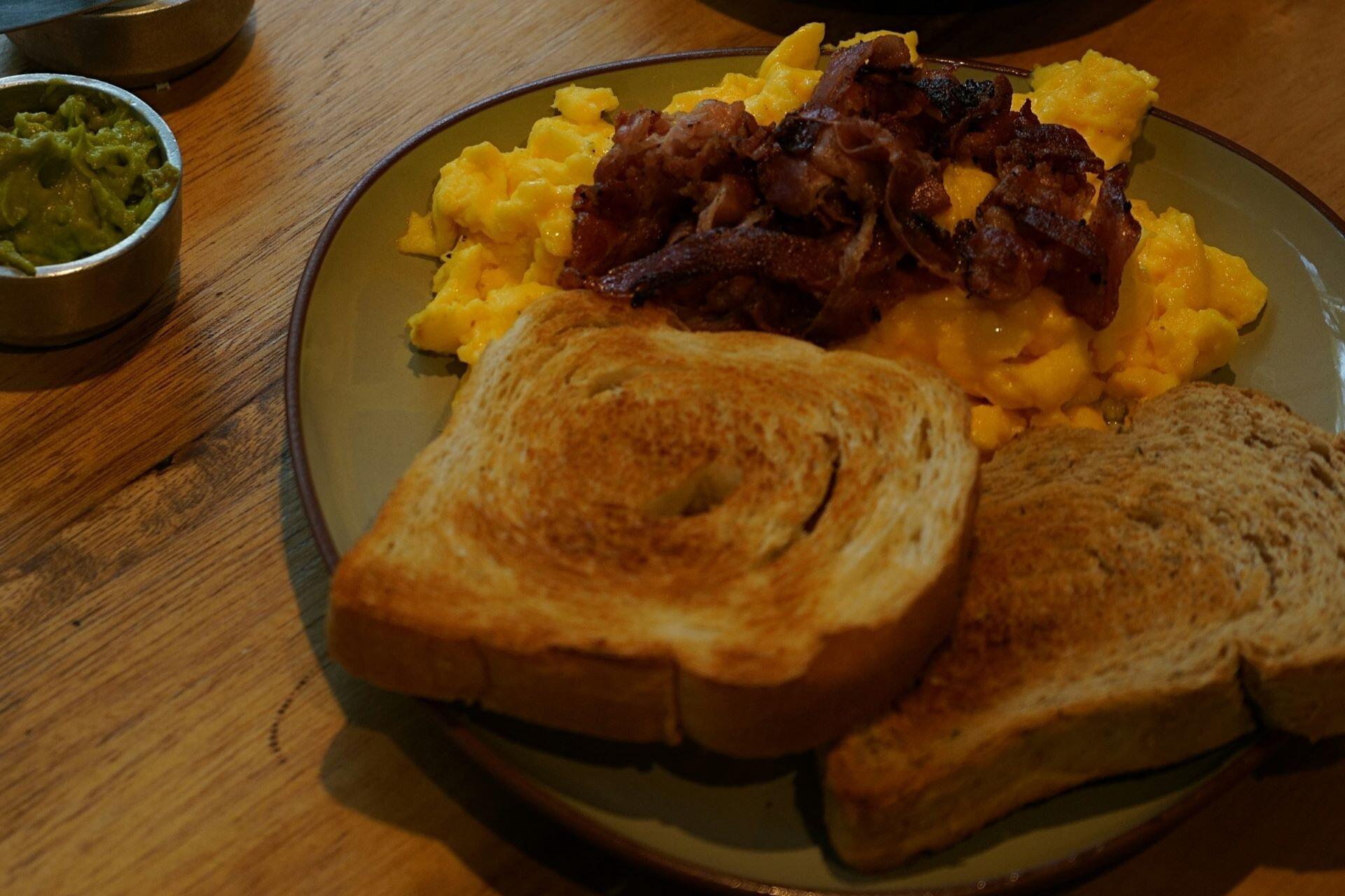 Café breakfast with eggs, toast and coffee