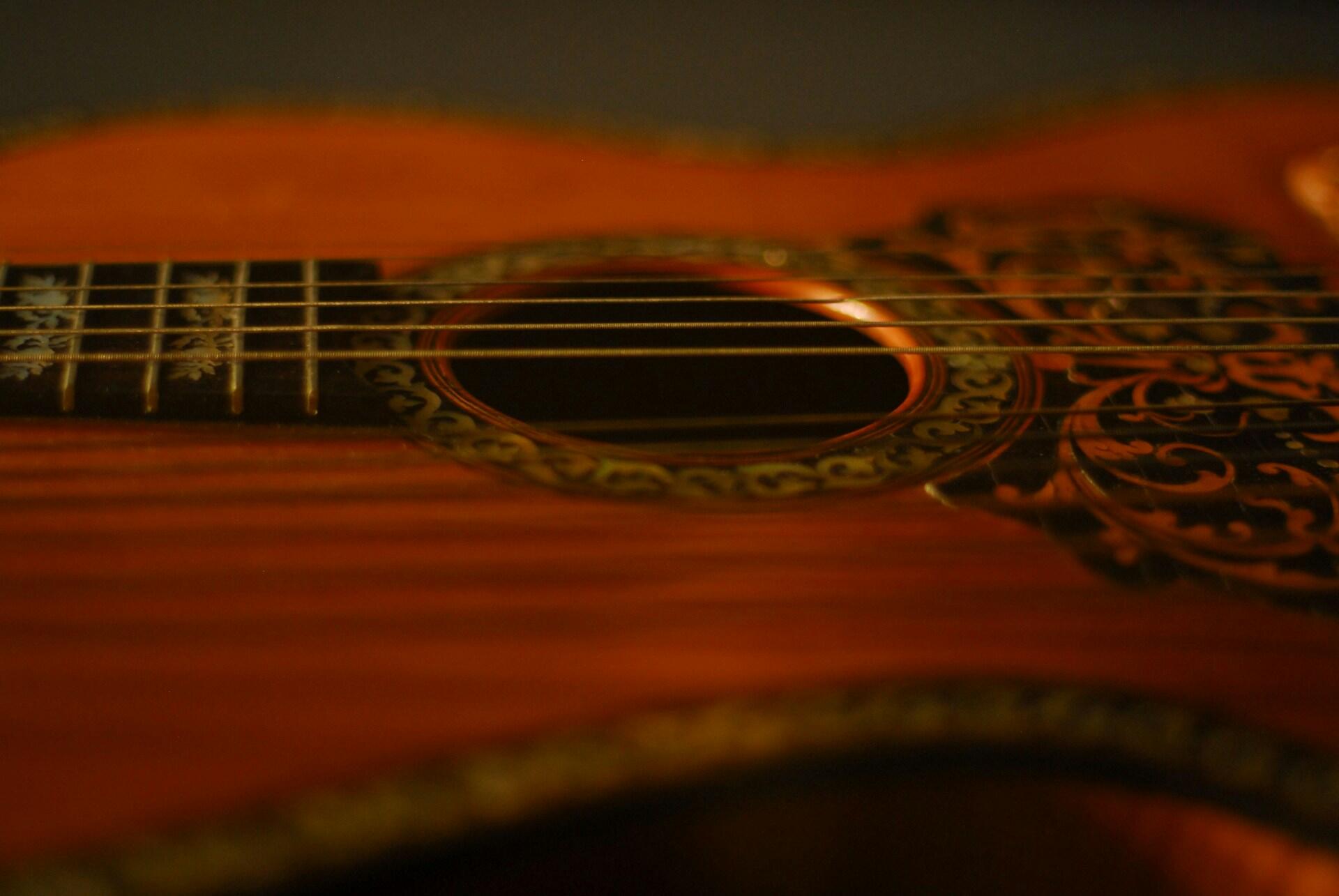 A closeup of a Spanish guitar.