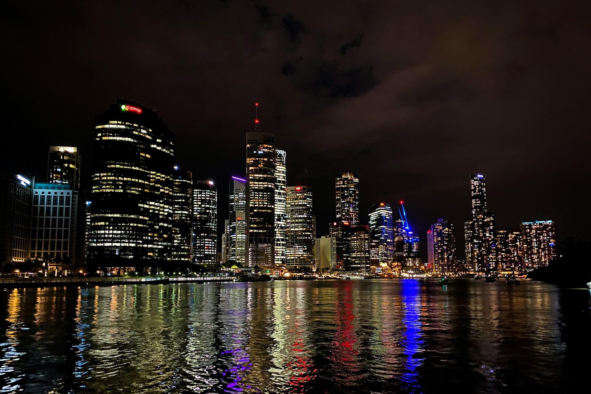 Brisbane skyline and waterfront at night.