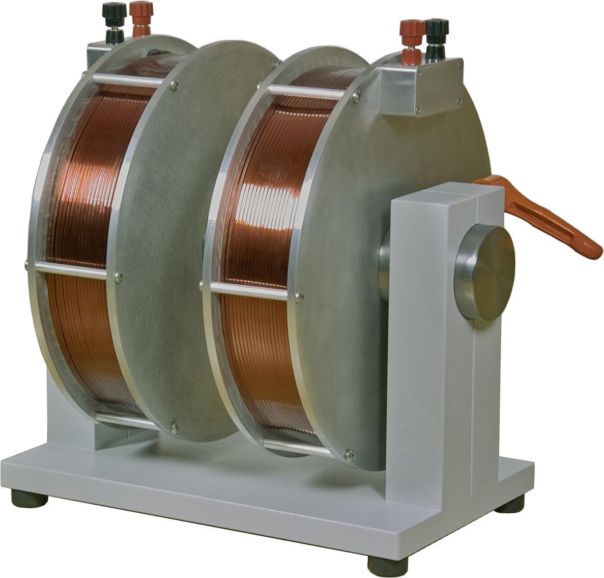 A device with two copper coils mounted in a grey frame. 