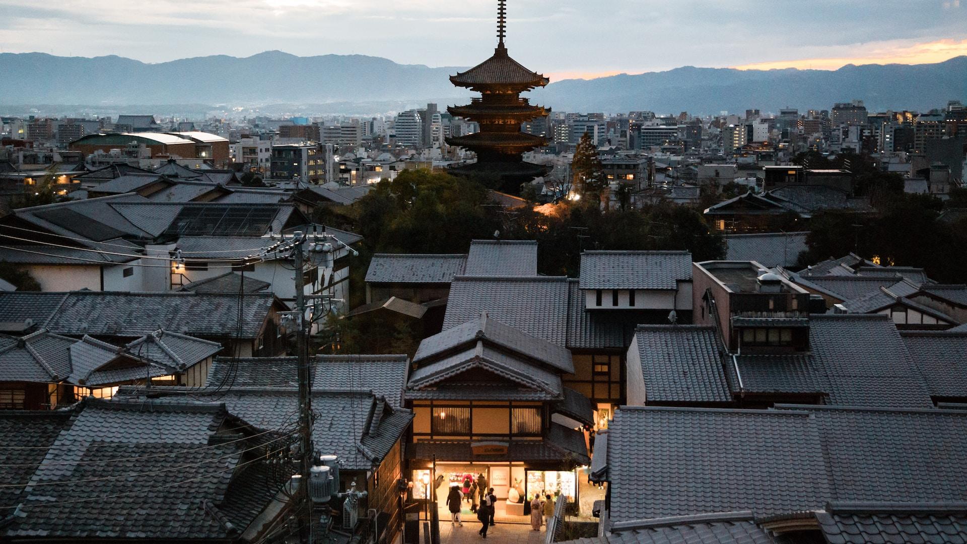 The city of Kyoto spread out under a watchful pagoda greets the day.