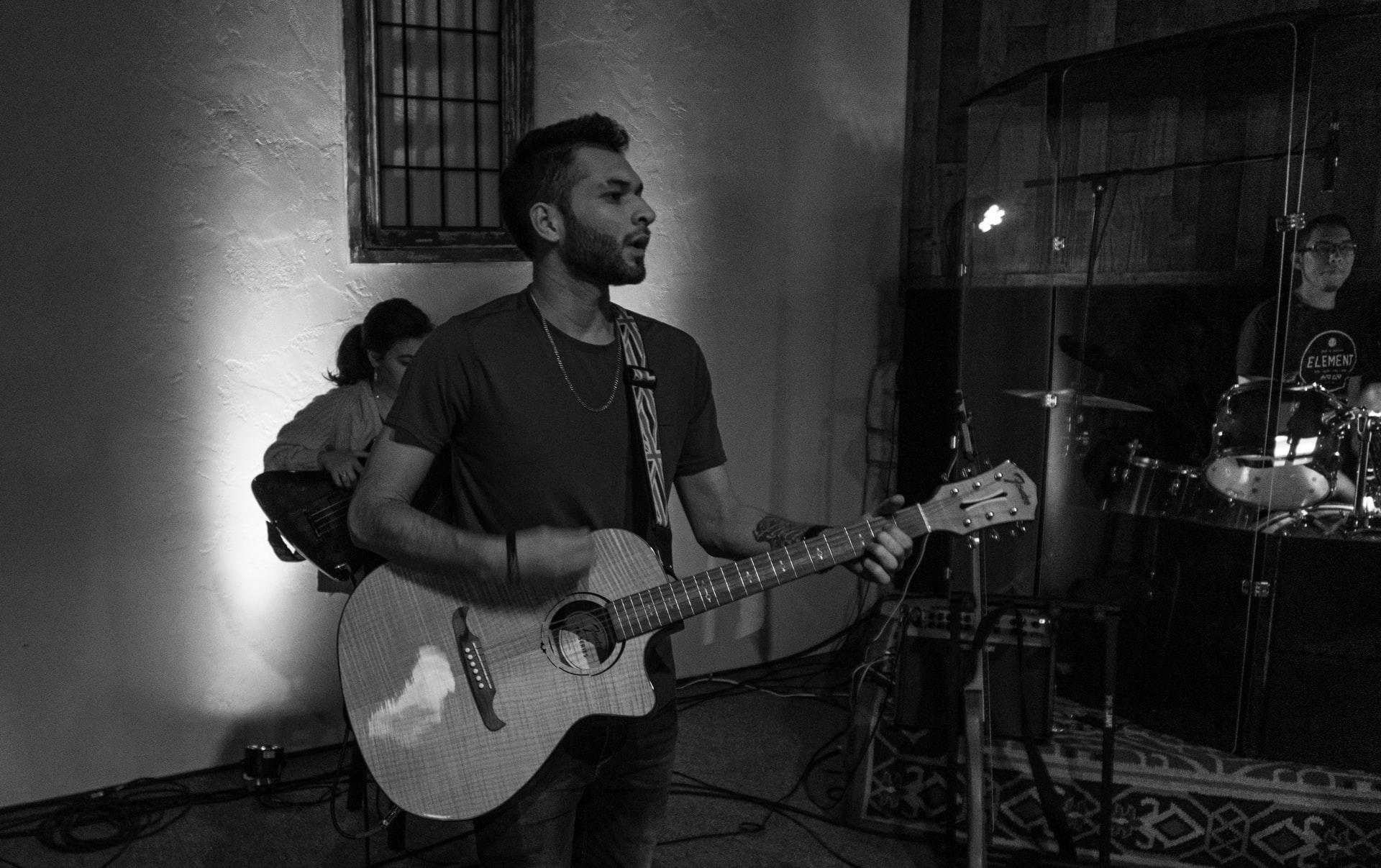 Playing the guitar in front of a crowd is a life-changing experience