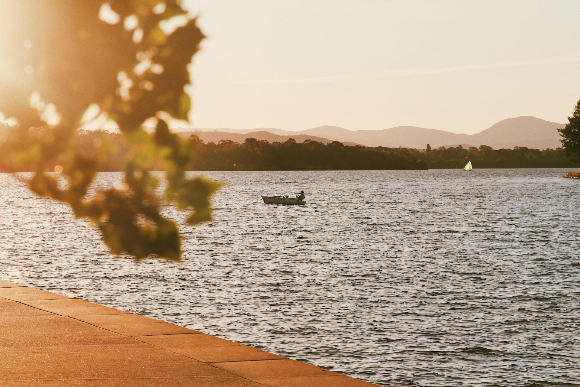 A view of a boat on Lake Burley Griffin in Canberra.