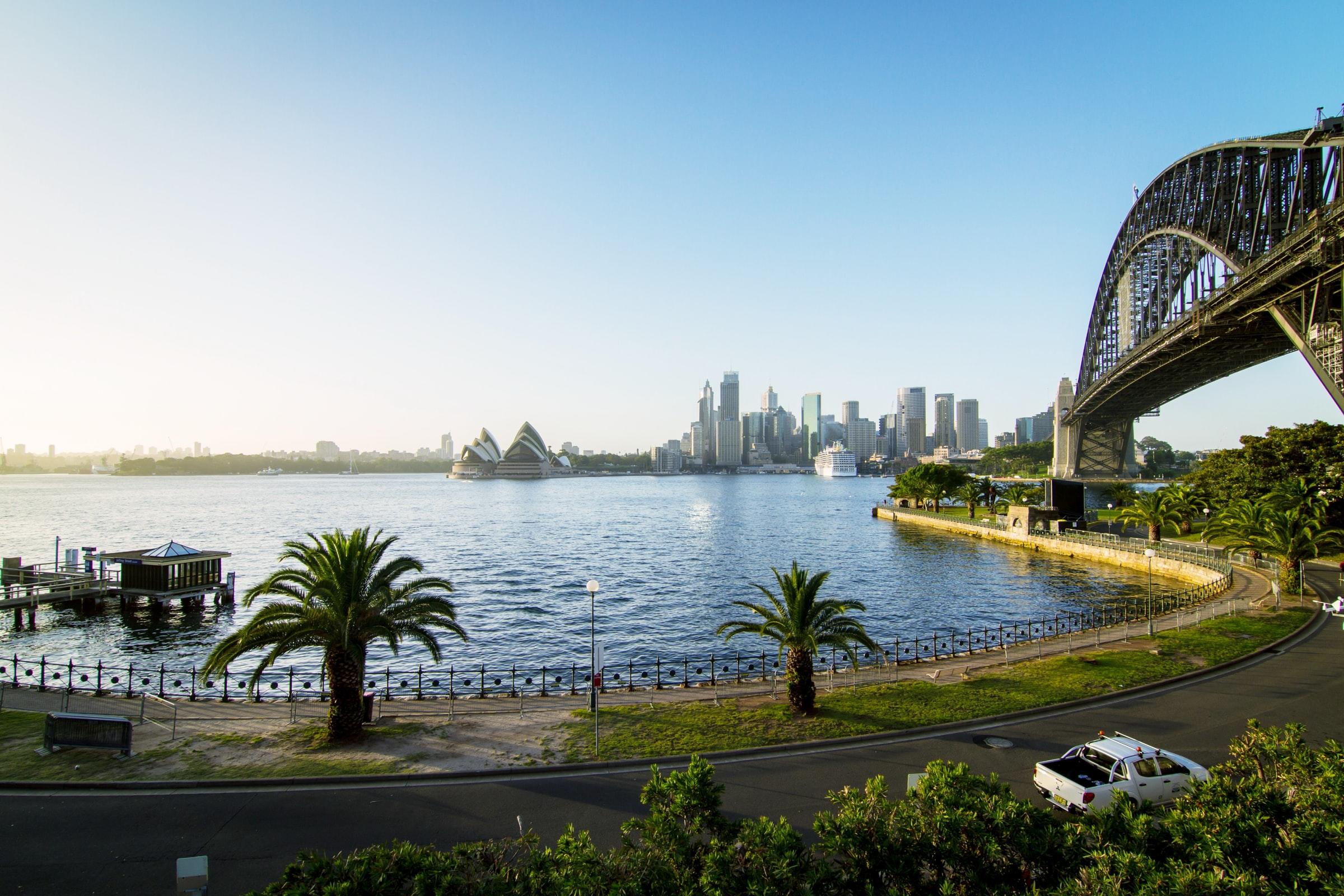 A bridge over a body of water on a sunny day.