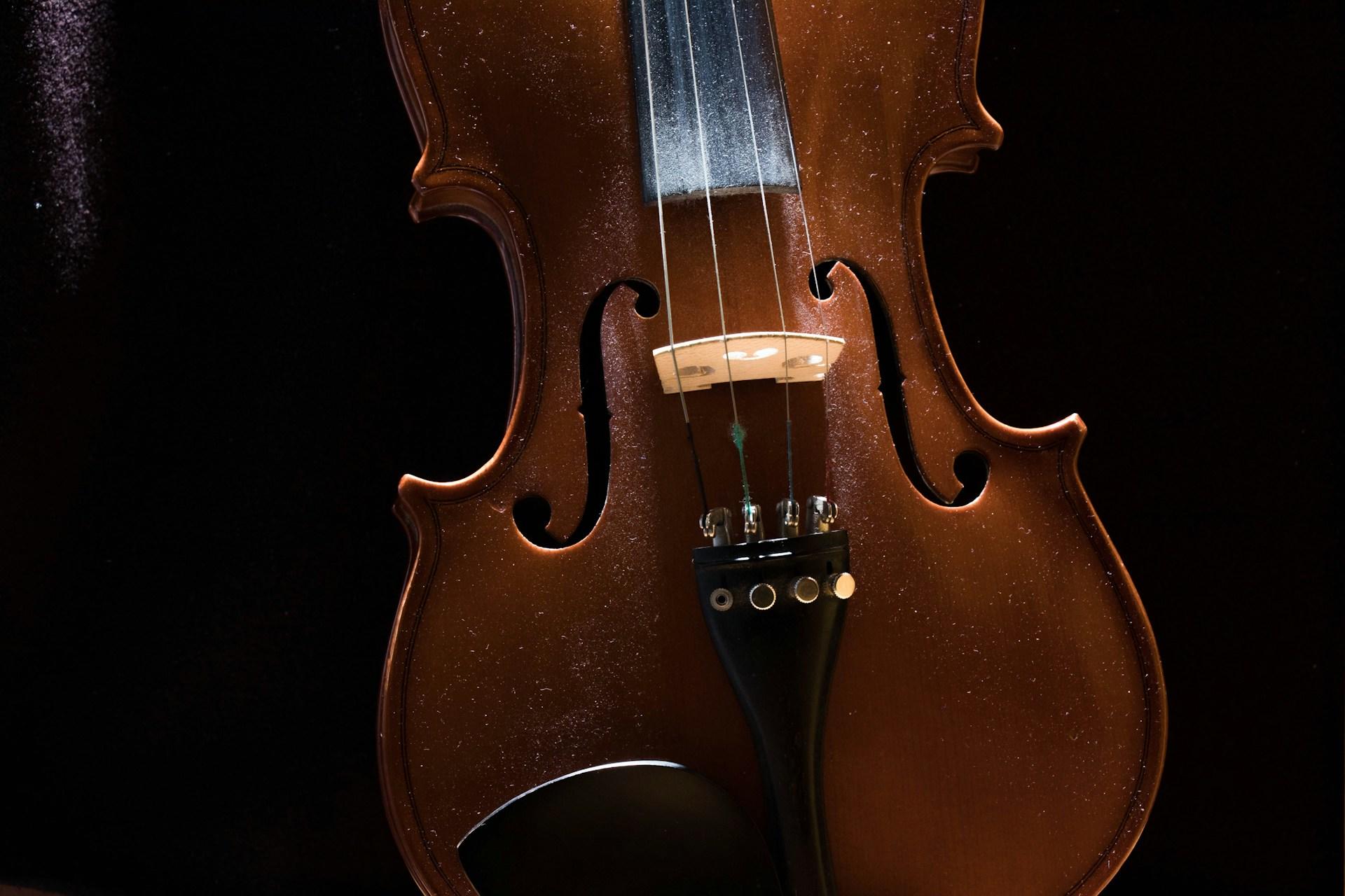 A violin displayed on a surface.