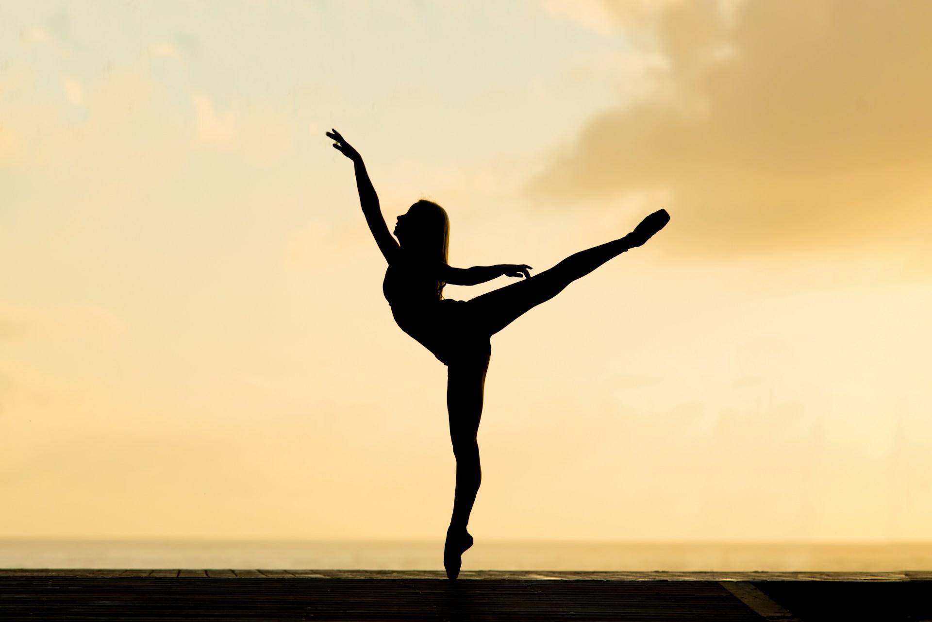 A ballerina silhouette.