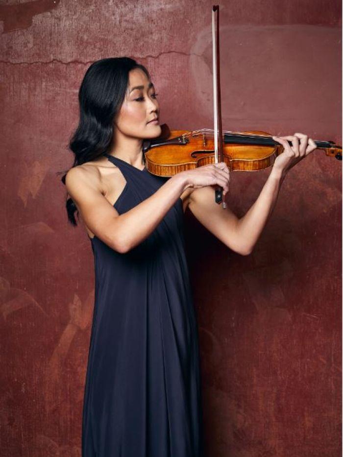 A female musician with a violin and a bow