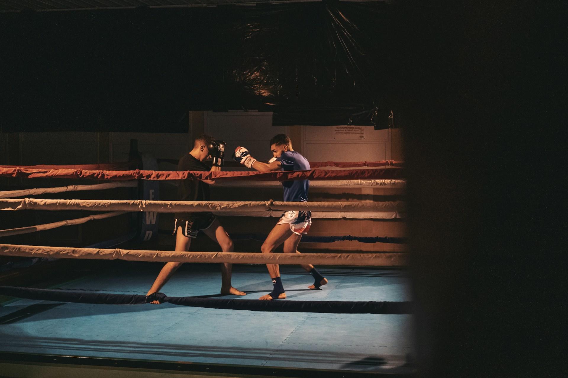 Two men practising boxing in a boxing ring