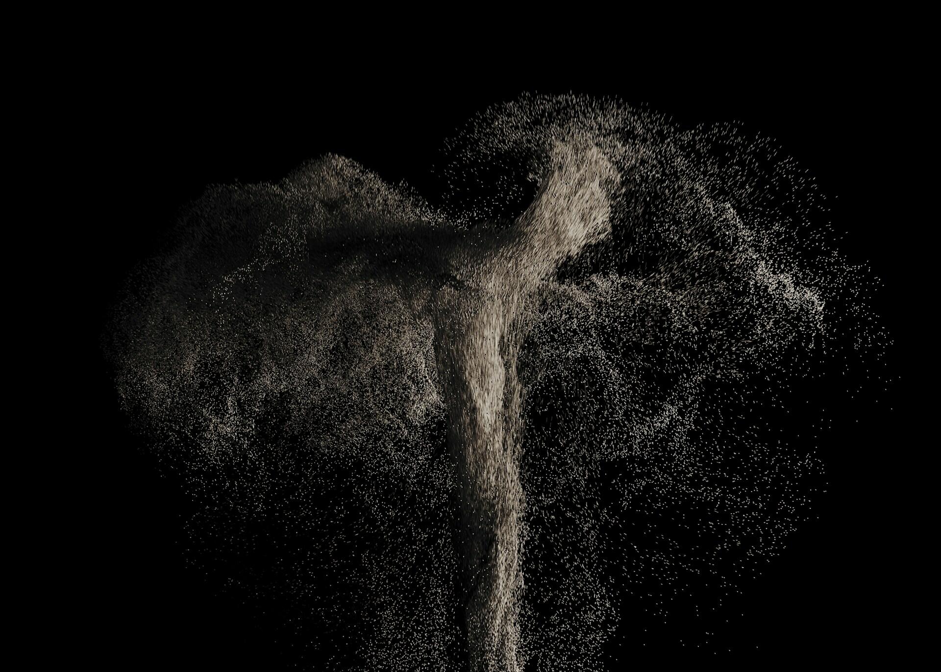 Particles travelling in random directions against a black background. 