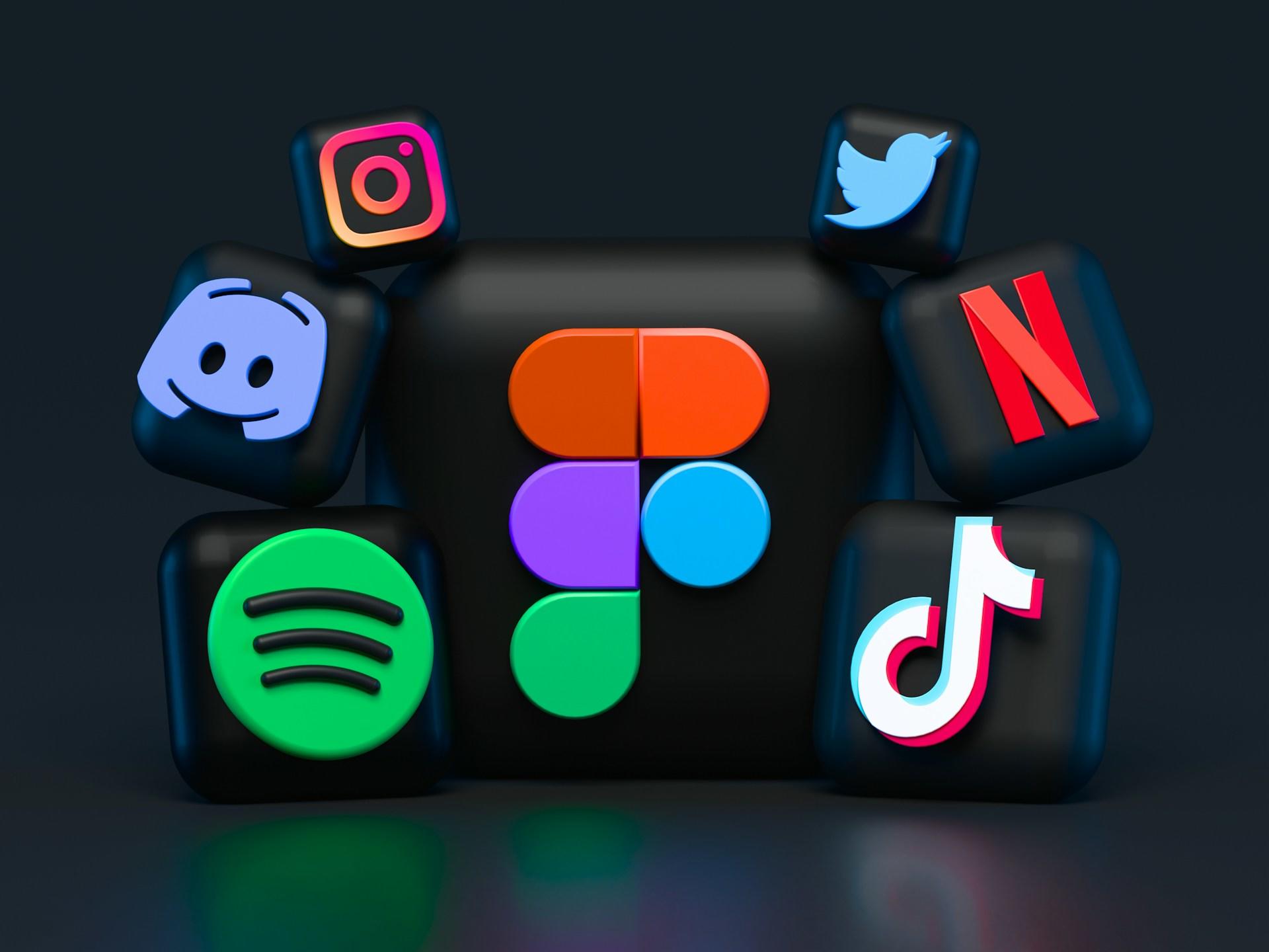 a group of black cubes with different colored icons