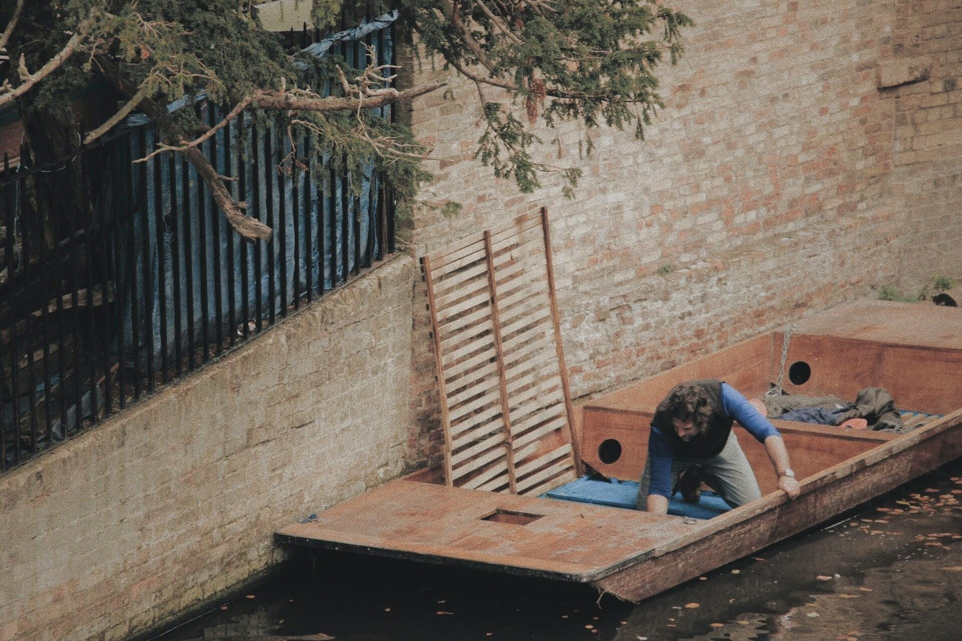 A construction worker on a barge.