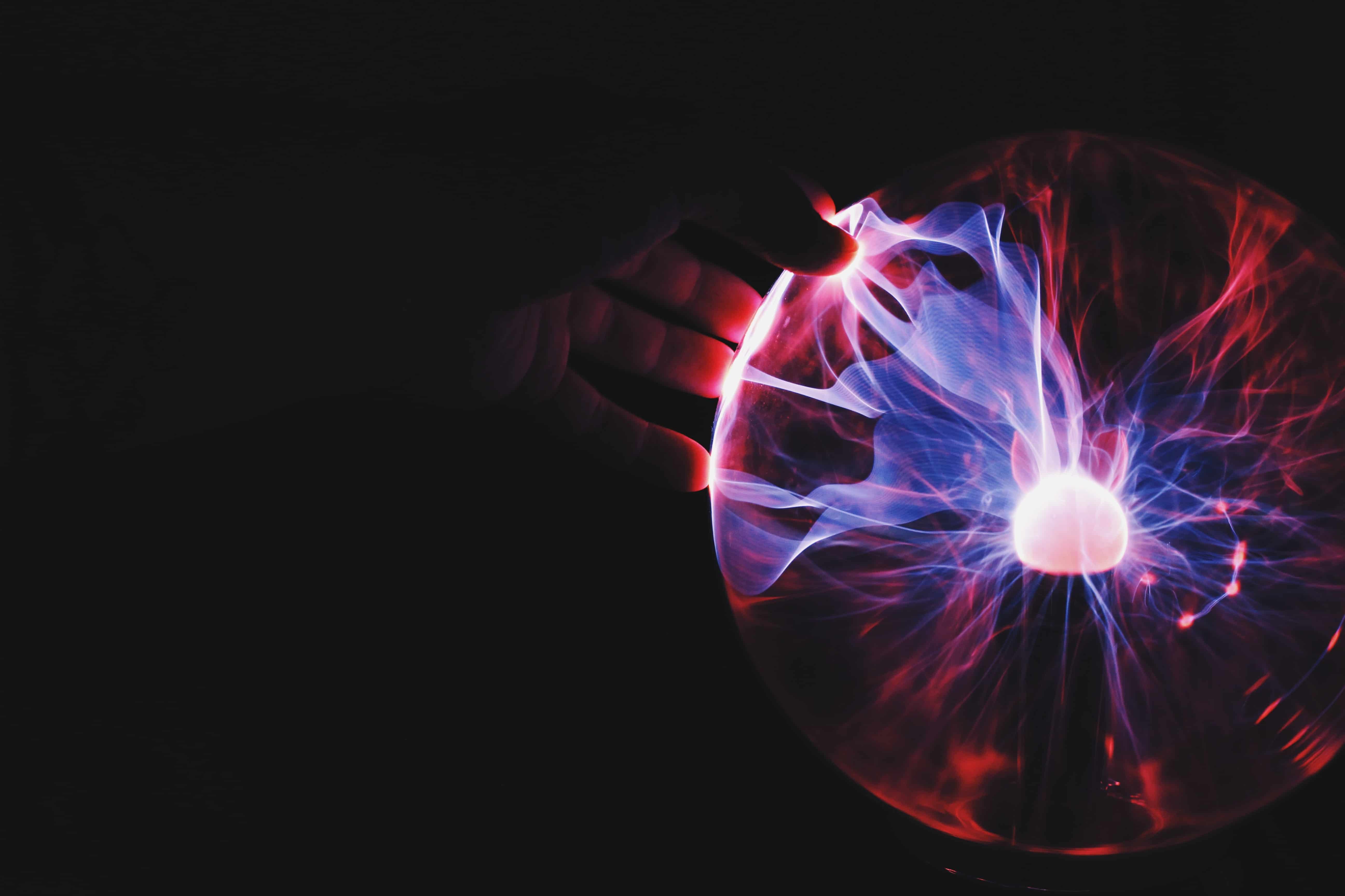 Closeup of a plasma globe in the darkness.