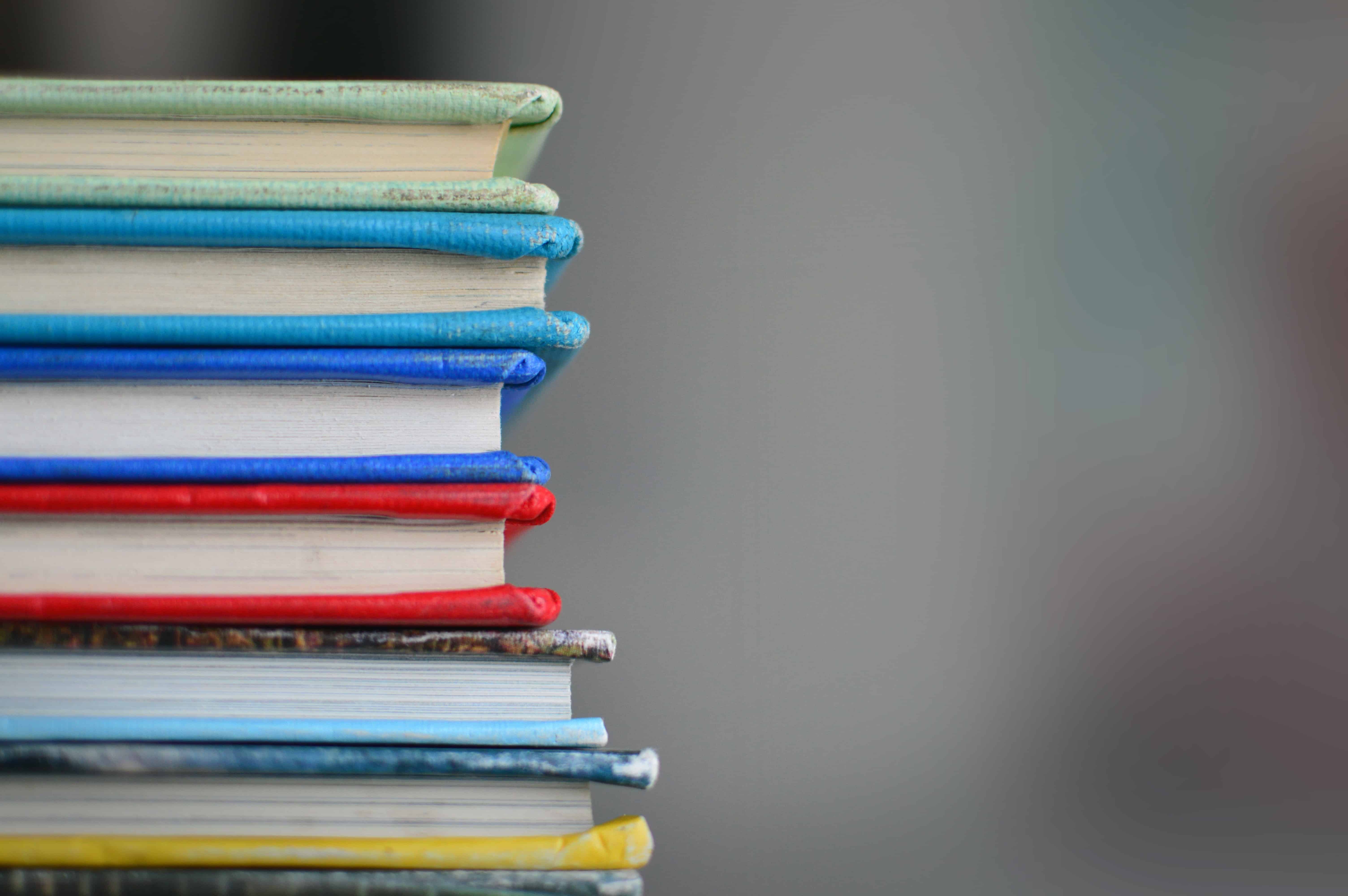 stack of books with coloured covers
