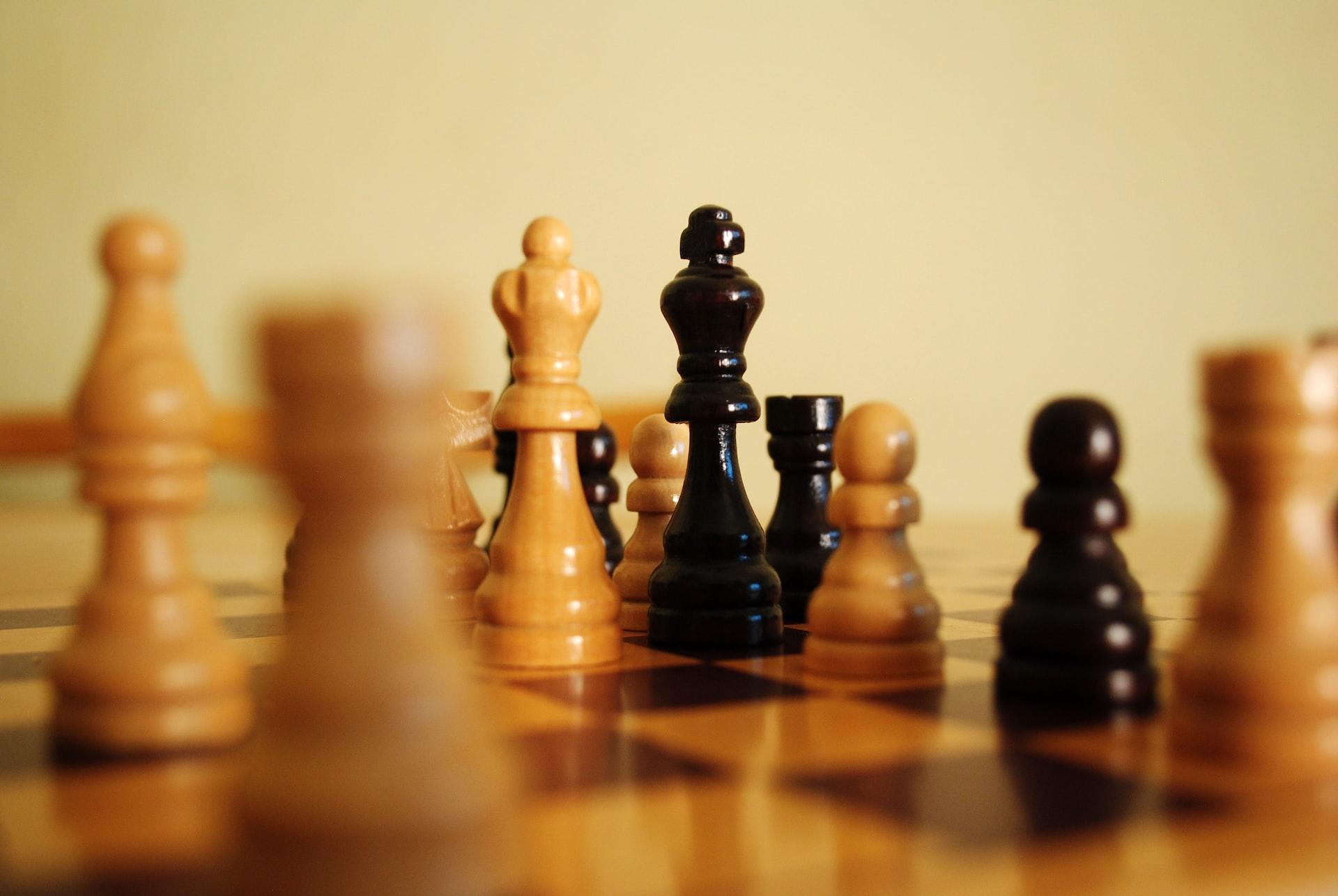 Black and white chess pieces on a board