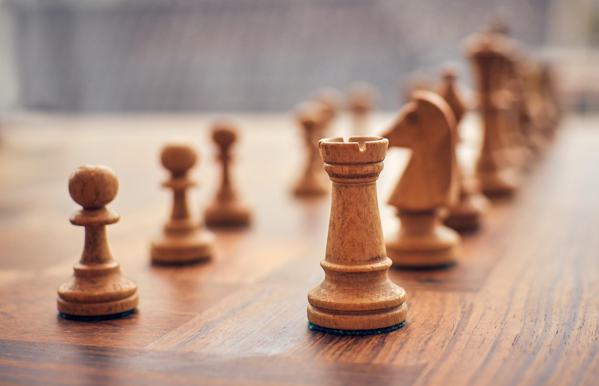 Brown chess pieces in the starting position