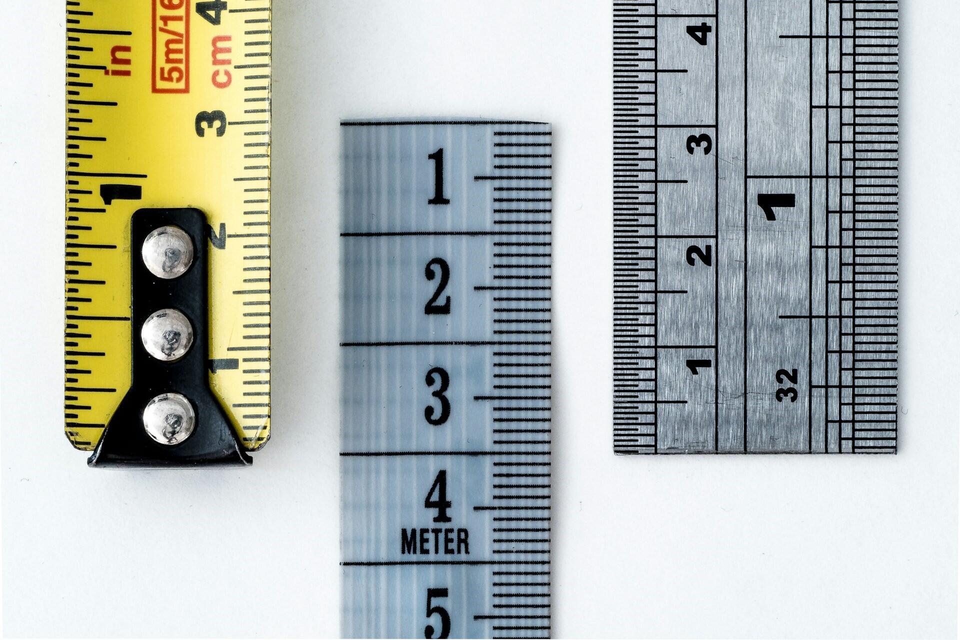 Three measuring tools with centimetre and inch markings