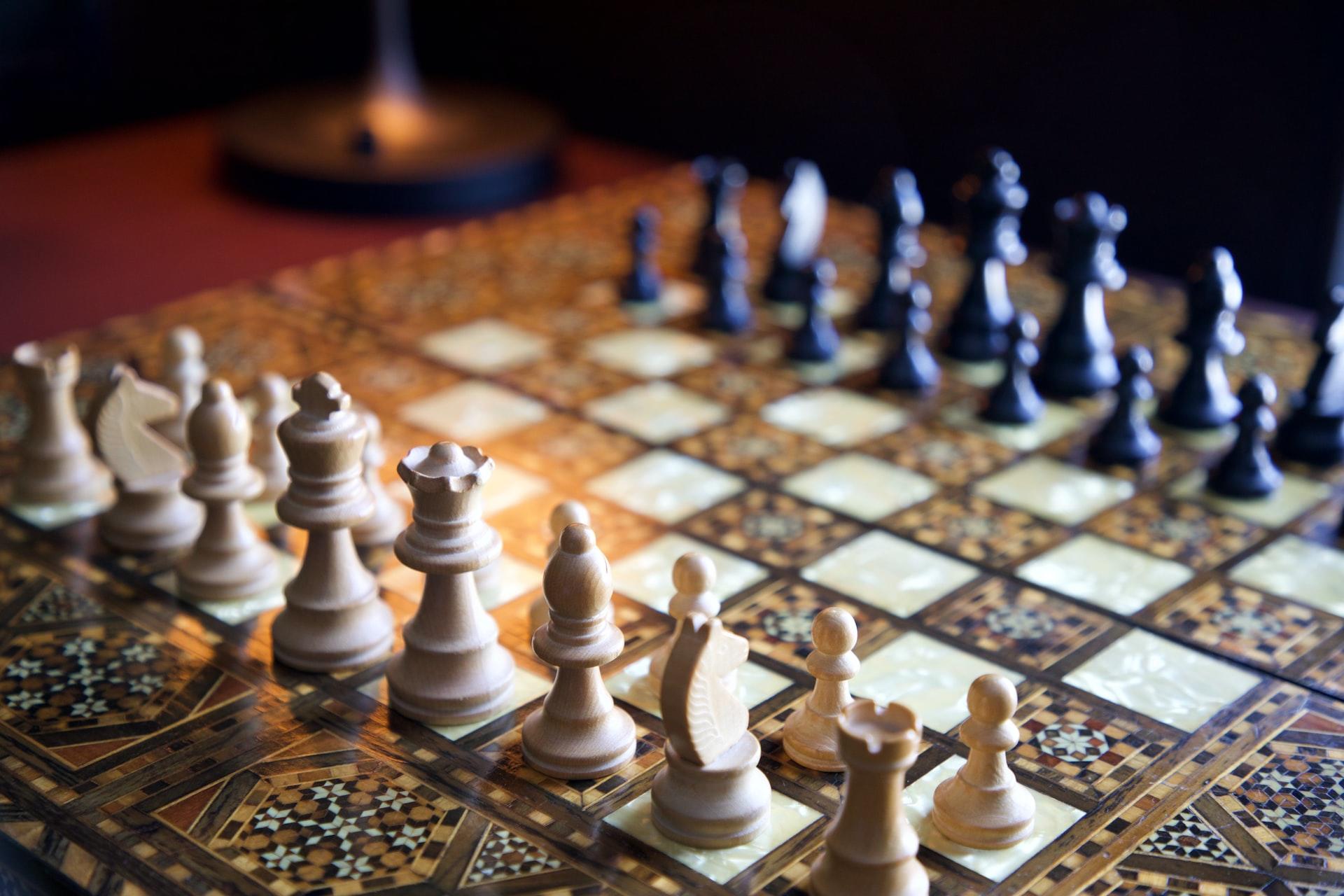 An ornate chess set ready to play a game
