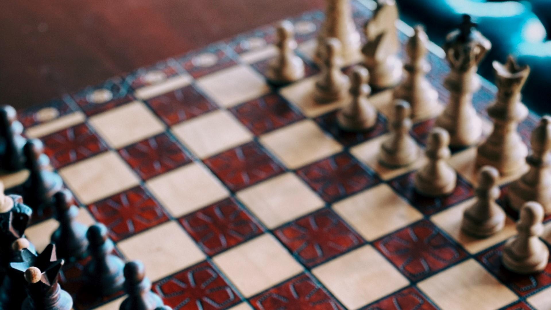 Ornate chess pieces in the starting position