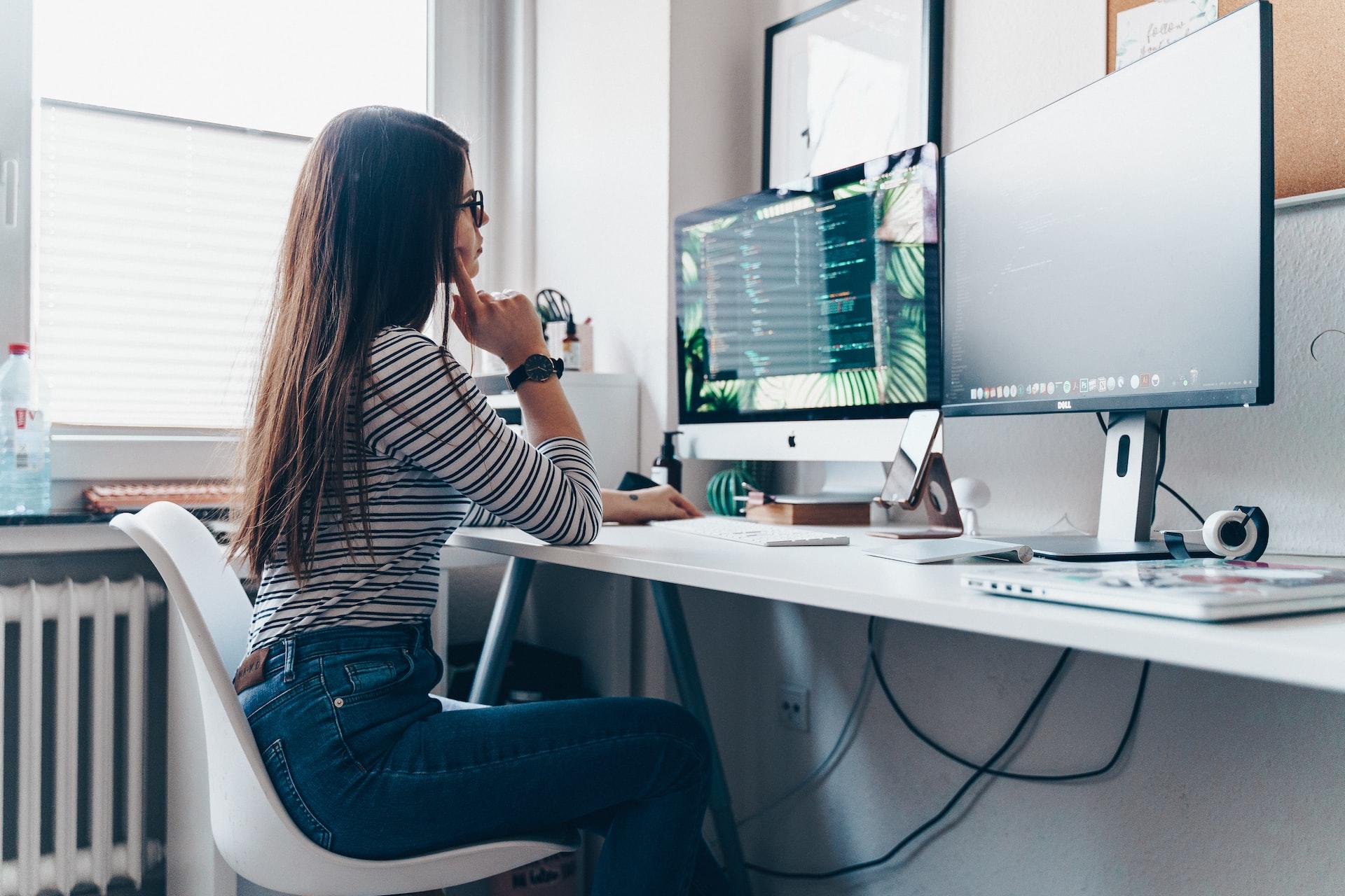 Person sitting at desk and programming