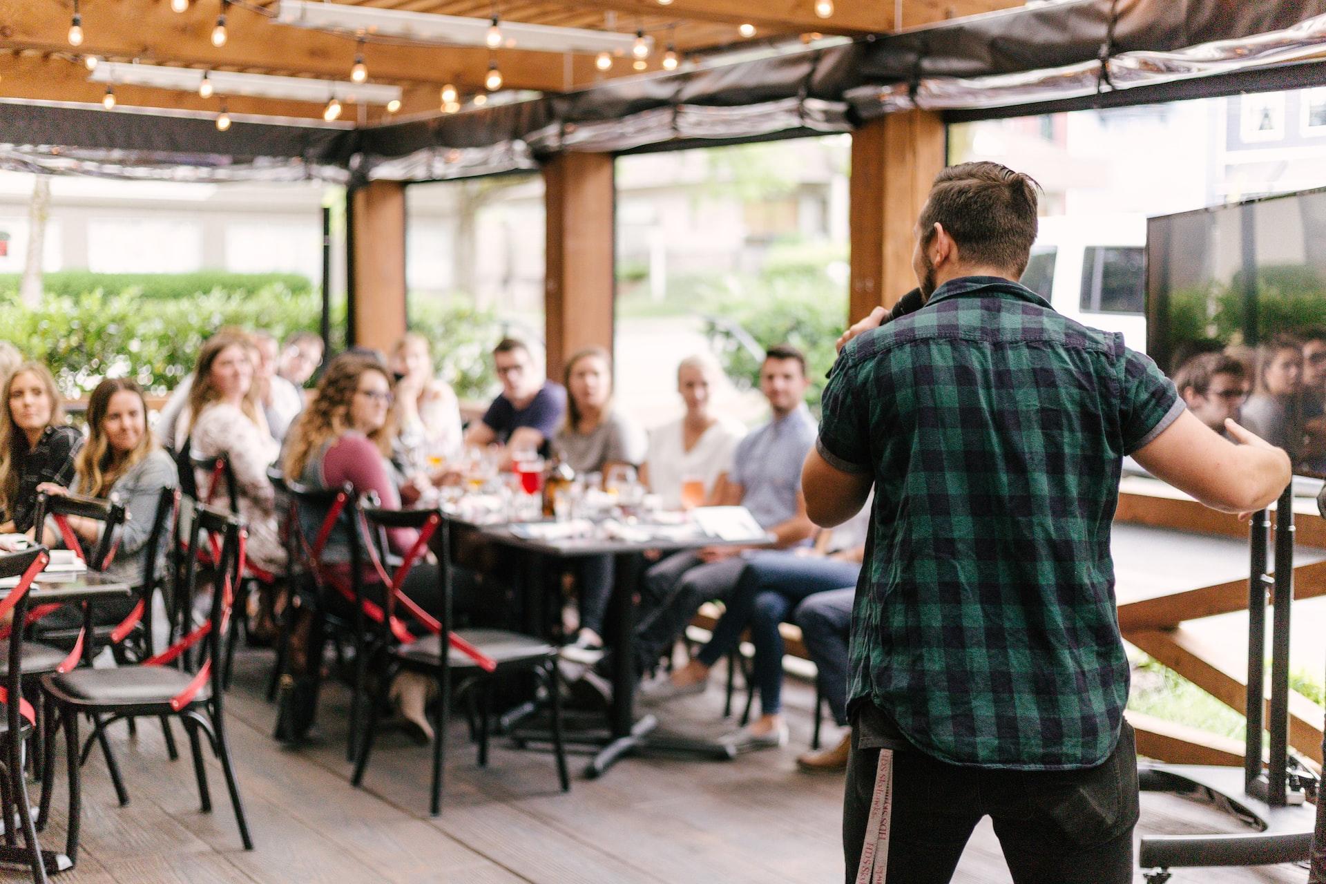 Man giving a speech in a restaurant