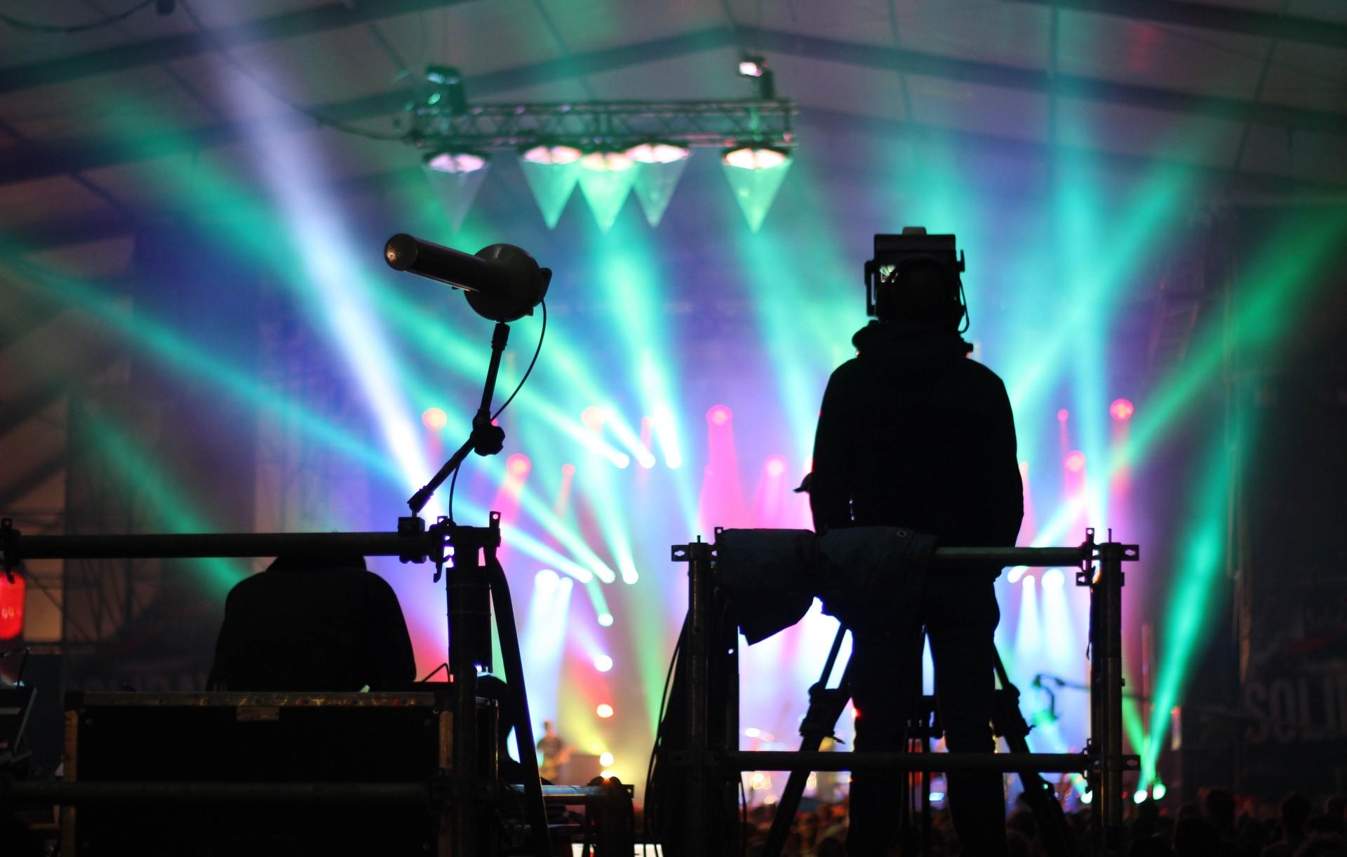 An electronic music performer at a concert