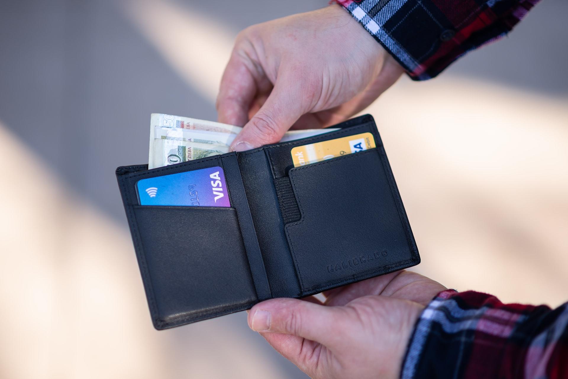 Person holding wallet