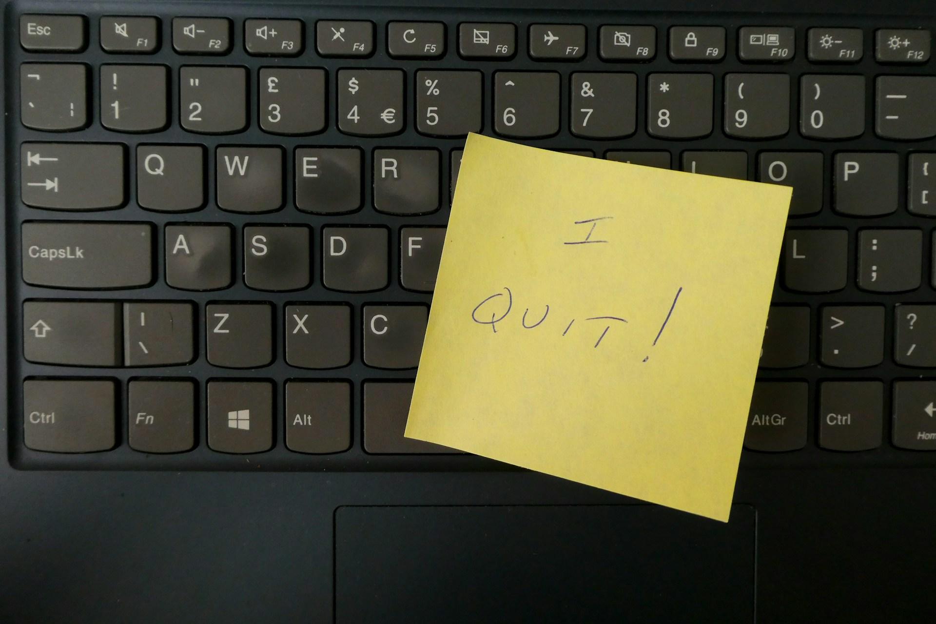 A yellow post it note on a keyboard, with 