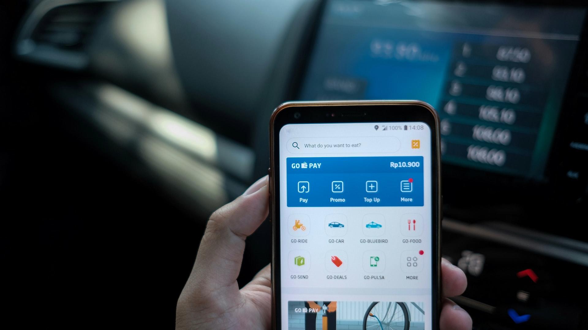 A person using a smartphone digital wallet