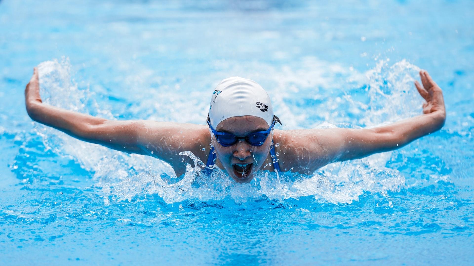 Person doing butterfly swimming stroke