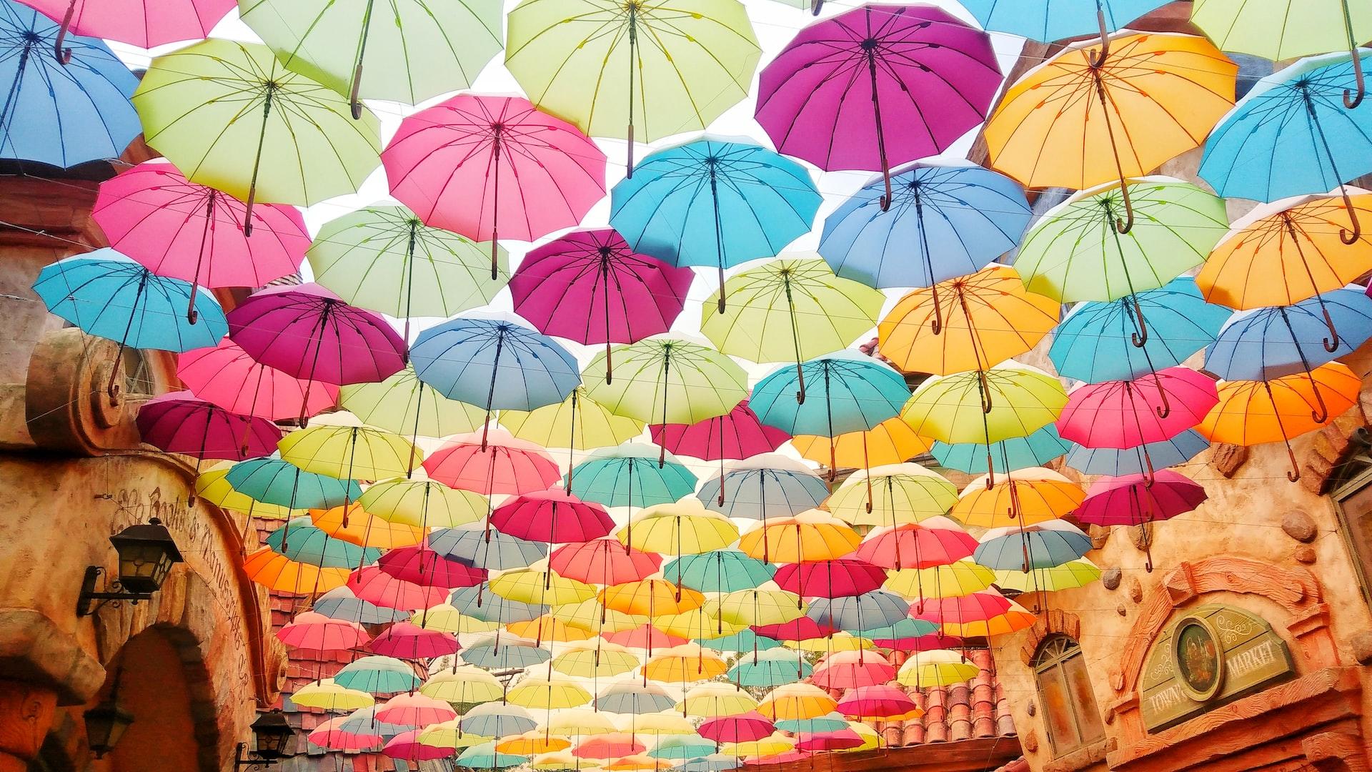 Coloured umbrellas hanging over a street in Everland theme park.