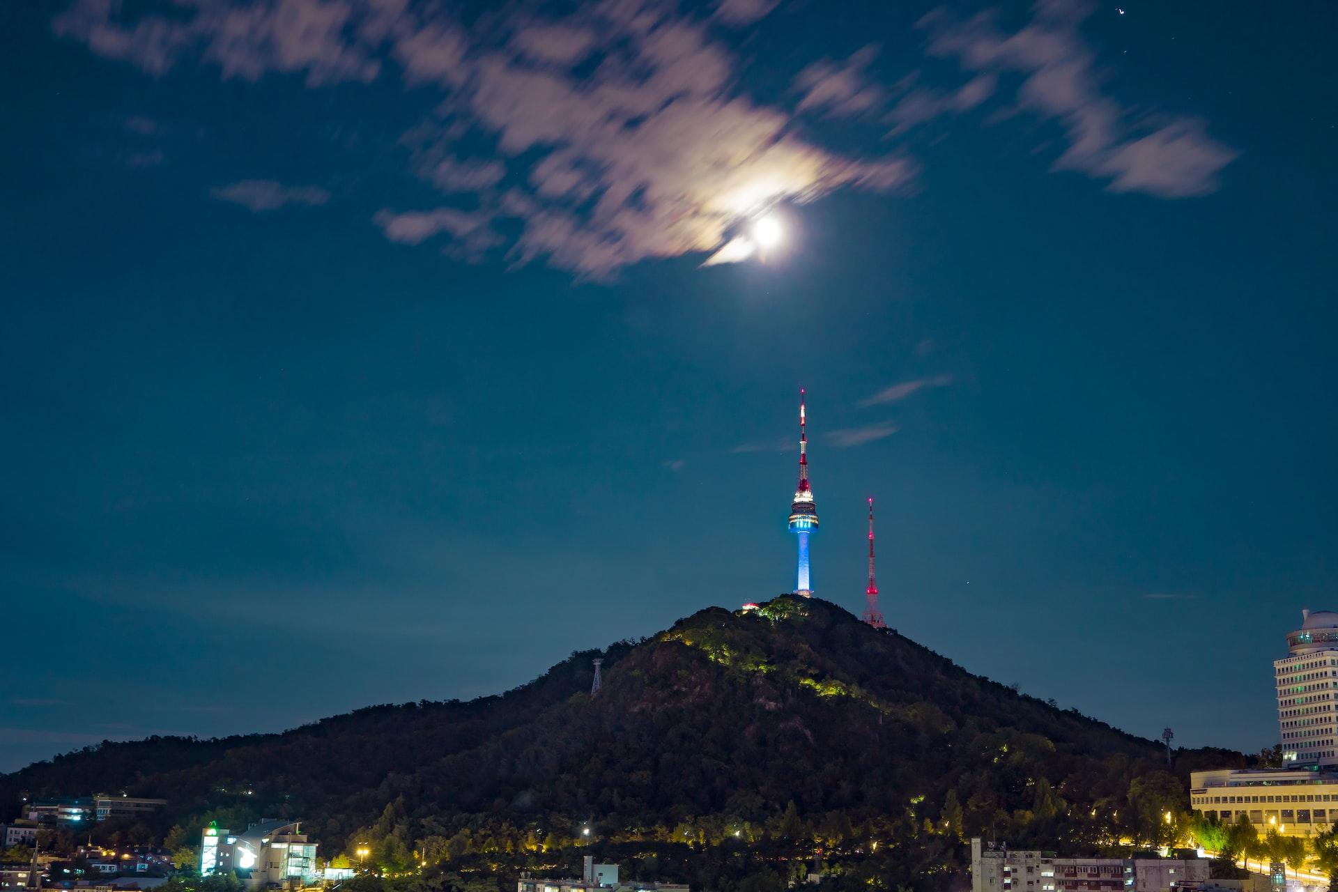 A view of a mountain and transmission tower in Seoul, South Korea