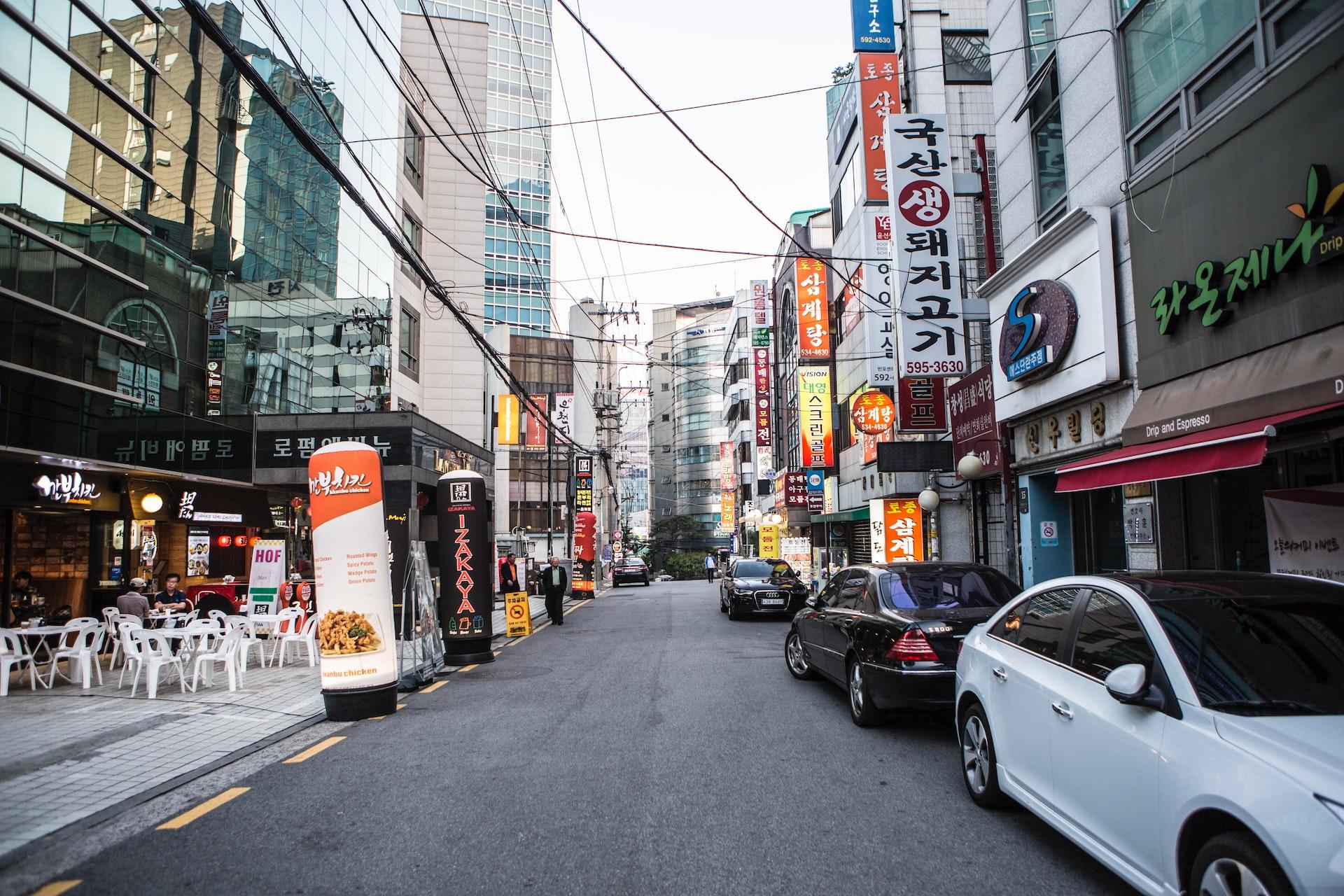 A street in South Korea with shops and a café