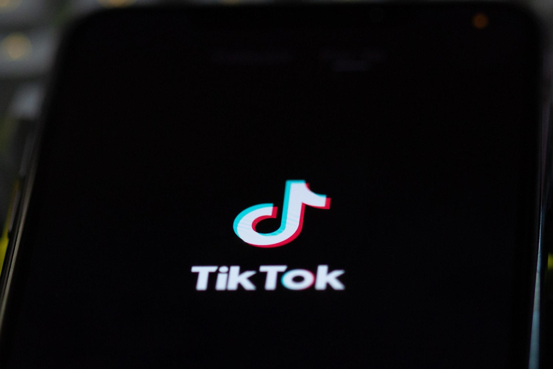 A close-up of a smartphone with the TikTok logo on it