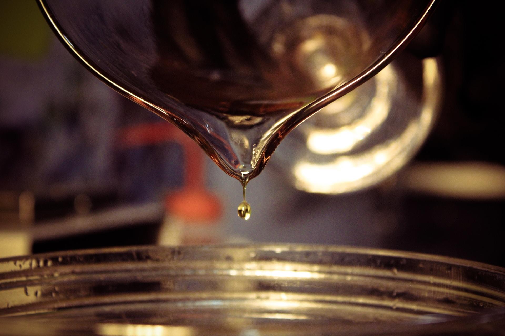 Chemicals being poured onto a dish.